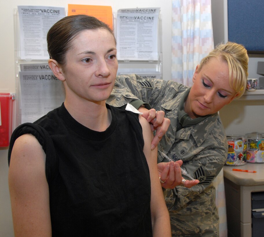 The 477th CES prepares to deploy to Iraq in the spring. Staff Sgt. Sammy Jeffery, 302nd Fighter Squadron medical technician, administers an anthrax vaccine to Staff Sgt. Jean Kukuk, 477th Civil Engineer Squadron.  This will be the first combat deployment for the squadron since World War II.  Their mission is to help plan, build, sustain and protect the base while providing combat-ready, deployable forces. (U.S. Air Force Photo by Staff Sgt. Rhiannon Willard)
