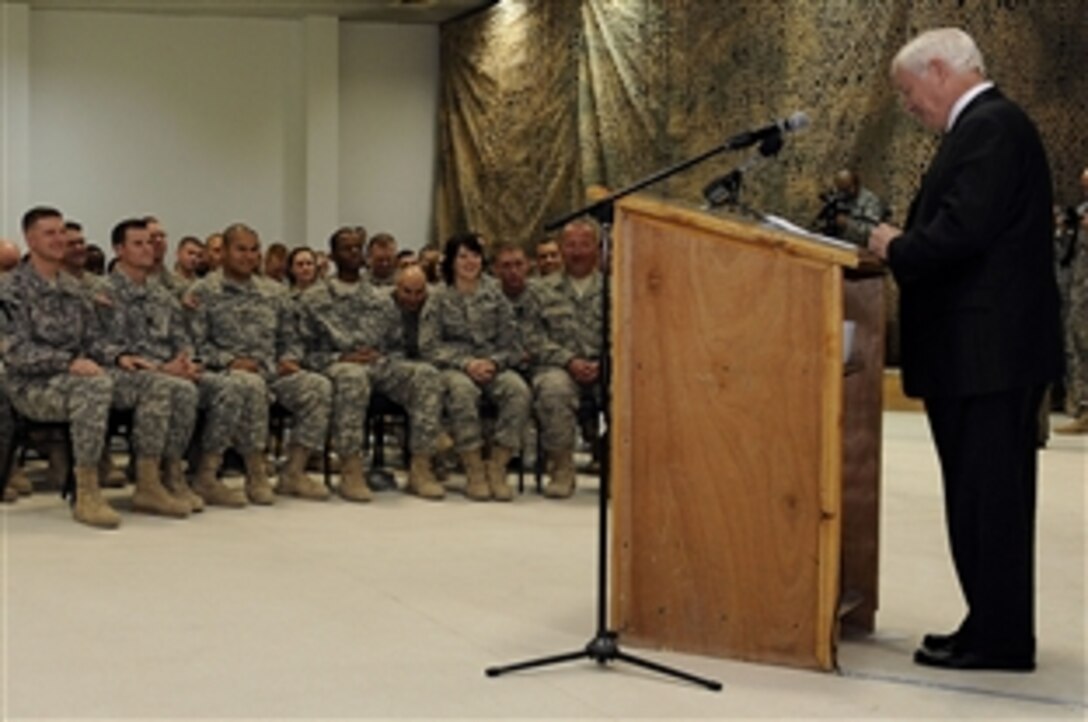 U.S. Defense Secretary Robert Gates holds a town hall meeting with the troops on Joint Base Balad, Iraq, Dec. 13, 2008. Gates finished a four-day tour of the Middle East in which he met with regional commanders and troops. 