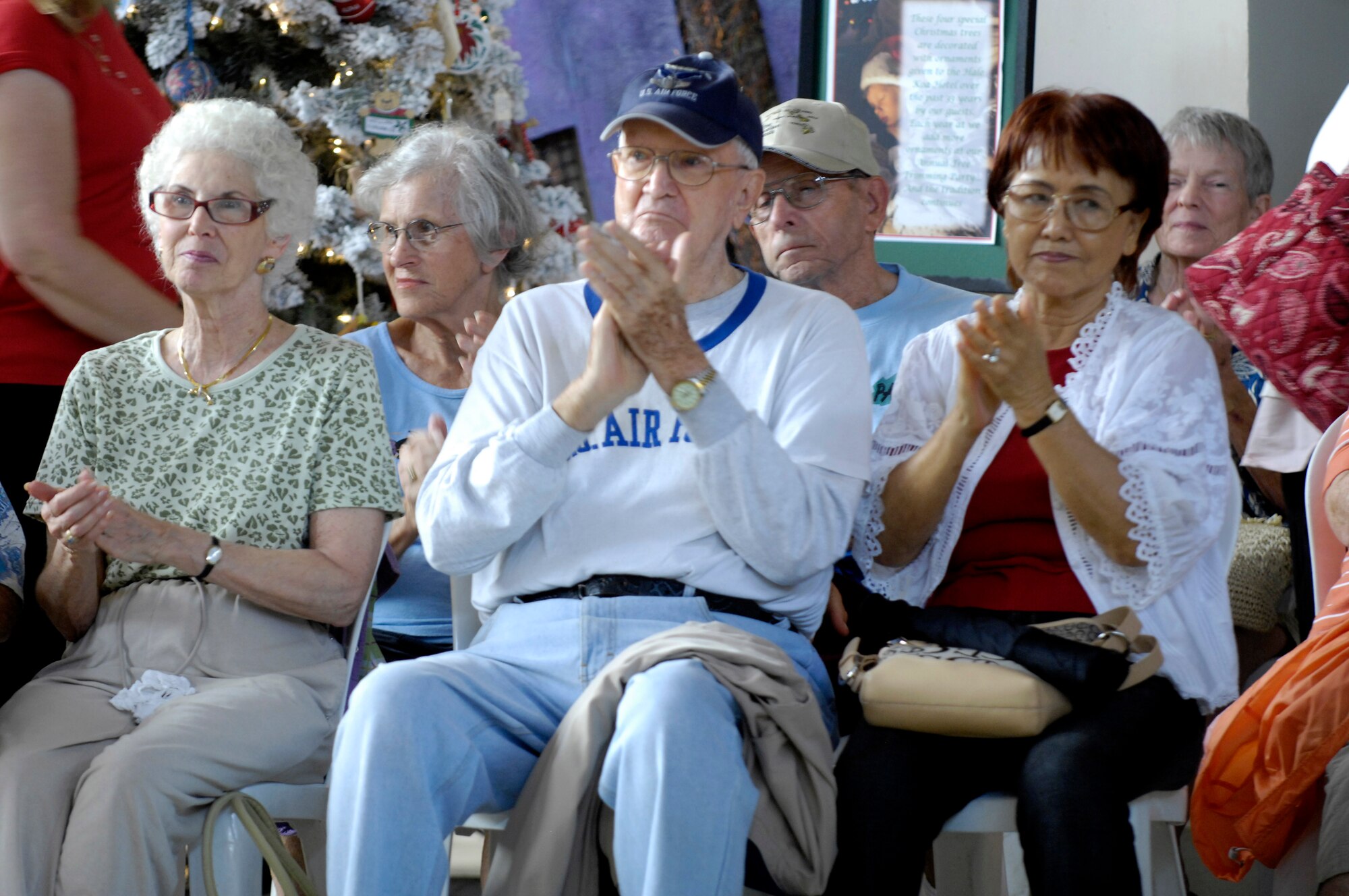 Guests of the Hale Koa military resort applaud the performance of the U. S. Air Force Band of the Pacific-Hawaii after the band entertained more than fifty guests of the resort on Dec. 11, 2008. The band performs at the Hale Koa for at least one show during the holiday season every year. (U.S. Air Force photo by Tech Sgt. Cohen A. Young/Released)