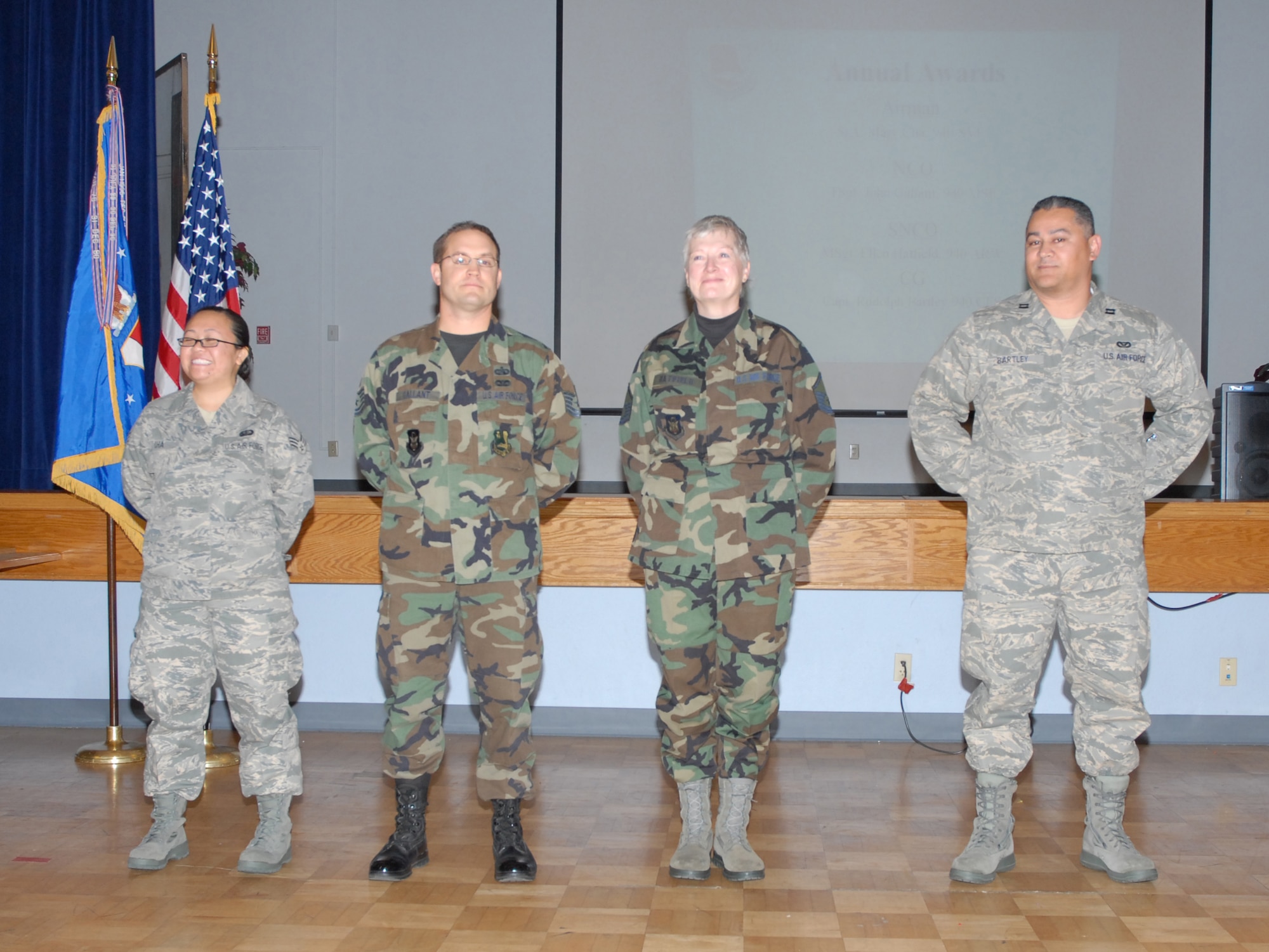 BEALE AIR FORCE BASE, Calif -- The 940th Air Refueling Wing Airmen of the year were congratulated during the wing's commanders call here Dec. 7, 2008. This years winners (left to right):  Airman of the Year, Senior Airman Mary Cha, 940th Services Squadron; Noncommissioned officer of the Year, Tech. Sgt. John Gallant, 940th Mission Support Flight; Senior NCO of the Year, Master Sgt. Ellen Hatfield, 940th ARW public affairs; Company Grade Officer of the Year, Capt. Rudolph Bartley, 940th Civil Engineer Squadron.  (U.S. Force Photo Tech. Sgt. Luke Johnson)
