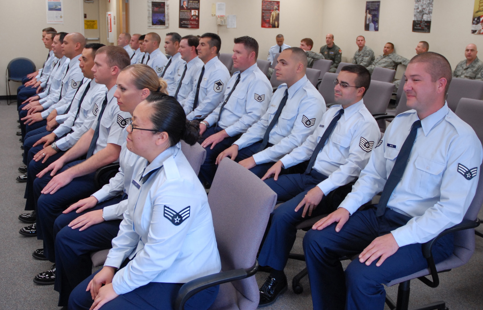 BEALE AIR FORCE BASE, Calif. -- Citizen Airmen from the 940th Air Refueling Wing eagerly wait to receive their certificates of completion from the Air Force Reserve Noncommissioned Officer Leadership Development Course during a graduation ceremony here Dec. 12, 2008. The two week course taught 940th NCOs important leadership and communication skills through class room instruction and various role play scenarios. The course was divided into two phases with two parts, a civilian instruction portion and a military facilitator portion. (U.S. Air Force Photo/ Master Sgt. Ellen Hatfield) 
