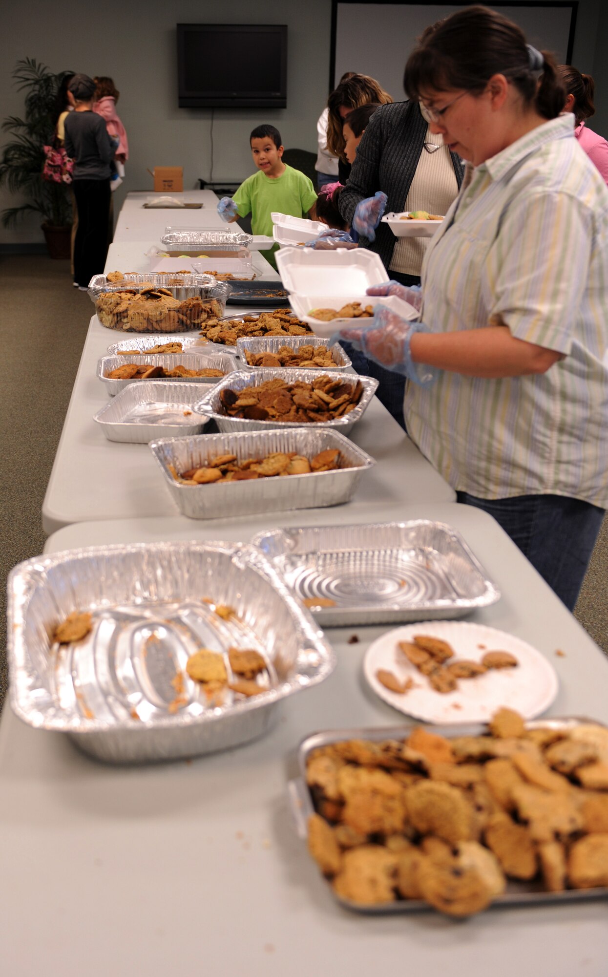MOODY AIR FORCE BASE, Ga. -- The Moody Spouses Club package and box cookies for this year’s annual cookie drive held Dec. 3 here. Donated cookies were given to Airmen who live on base in the dormitories. (U.S. Air Force photo by Airman Joshua Green) 