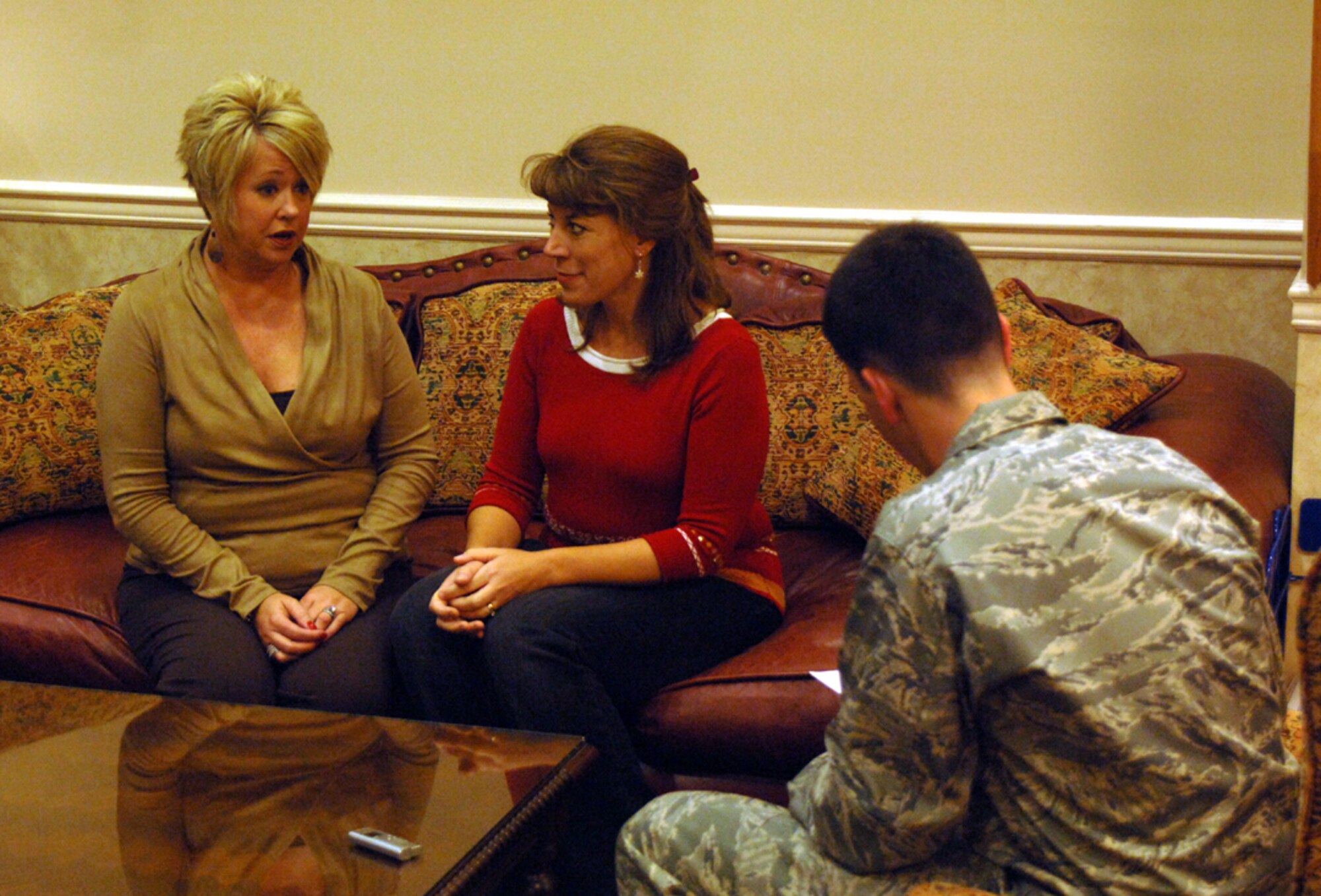 Debbie Brackett, wife of Chief Master Sgt. Richard Brackett, 14th Flying Training Wing Command Chief Master Sergeant, and Leslie Watkins, wife of Col. Roger Watkins, 14th FTW commander, discuss their goals regarding their new on-base organization, FANS, during an interview Dec. 4 at the Airman and Family Readiness Center. (U.S. Air Force photo by Airman Josh Harbin)