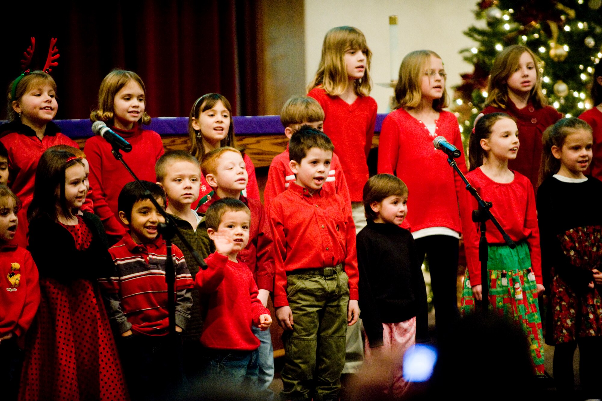 ELMENDORF AIR FORCE BASE, Alaska -- Members of the Chapel's Children's Choir sing Christmas songs for the attendants of the Christmas tree lighting ceremony at Chapel 1 Dec. 11. (U.S. Air Force photo/Senior Airman Jonathan Steffen) 