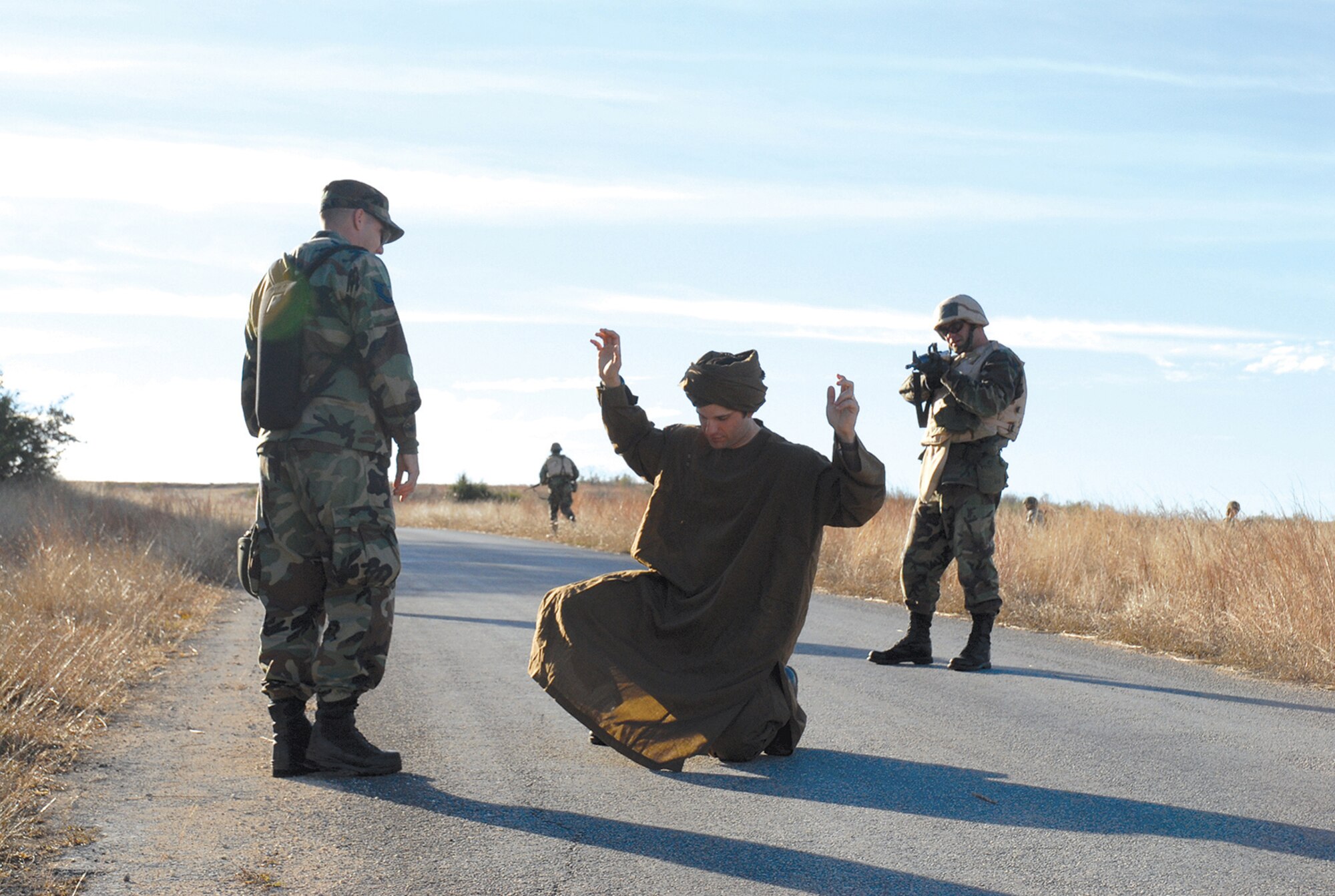 Maj. Roy Thrailkill (right) from the Air Education and Training Command, challenges Combat Controller and CBAT-B instructor, Staff Sgt. Joe Pearcy (center), while Tech. Sgt. Christopher Dunstone, Combat Weather Specialist and CBAT-B instructor, acts as an interpreter. 
