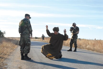 Maj. Roy Thrailkill (right) from the Air Education and Training Command, challenges Combat Controller and CBAT-B instructor, Staff Sgt. Joe Pearcy (center), while Tech. Sgt. Christopher Dunstone, Combat Weather Specialist and CBAT-B instructor, acts as an interpreter. 