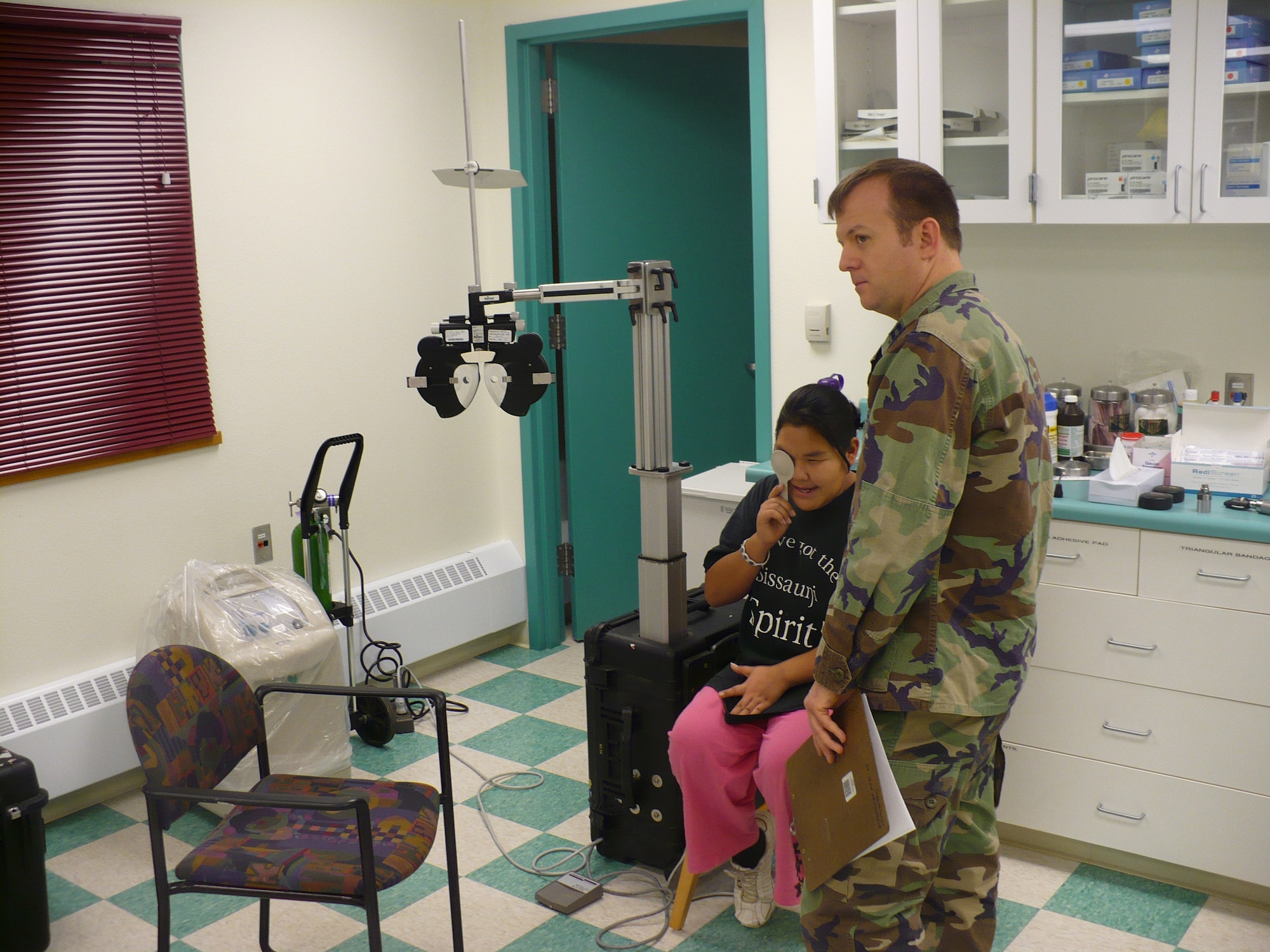 DEERING, Alaska -- Capt. Erich Wanagat, 3rd Aerospace Medicine Squadron, administers an eye exam to an Alaskan native. The 3rd Medical Group provided nearly $7,000 worth of optometry during the trip to Deering. The Arctic Medics assisted nearly 800 patients and more than $115,000 worth of medical care. (U.S. Air Force photo)