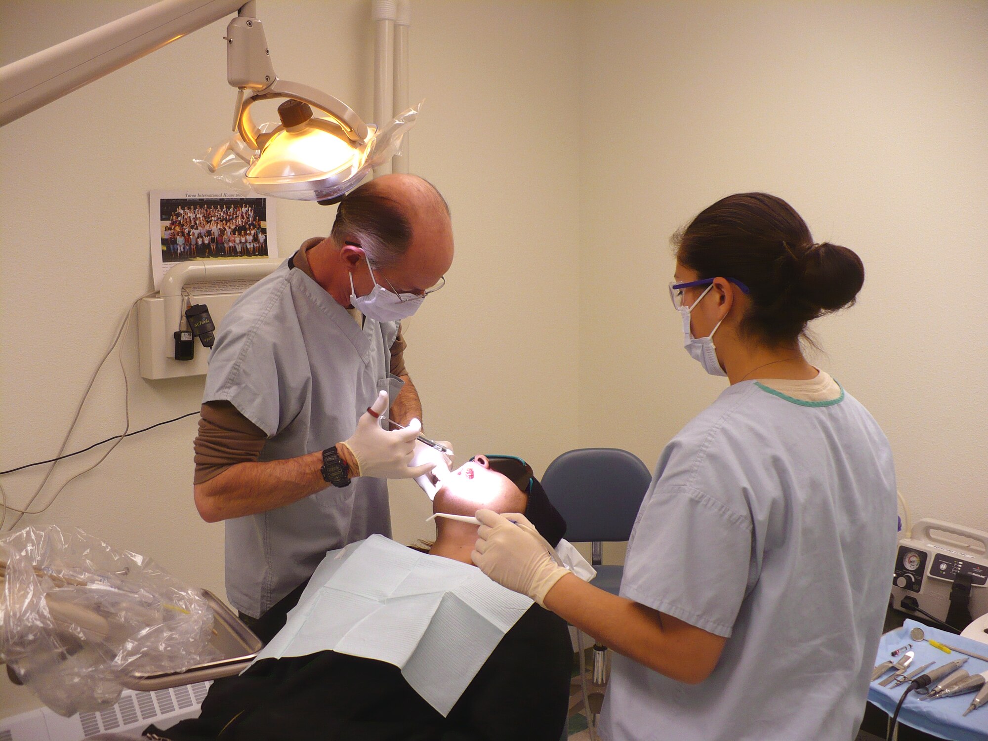 DEERING, Alaska -- Col. James Wimsatt and Staff Sgt. Jennifer LaPlante, 3rd Dental Squadron, preform dental surgery on an Alaskan native. The 3rd Medical Group provided more than $35,000 worth of medical care to rural citizens during their trip to remote villages. The Arctic Medics assisted nearly 800 patients and more than $115,000 worth of medical care. (U.S. Air Force photo)