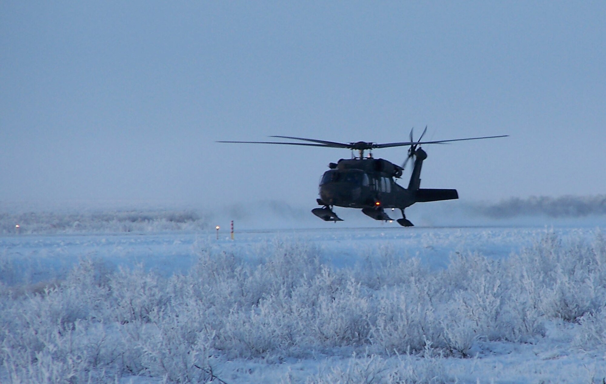 BUCKLAND, Alaska -- A UH-60 Blackhawk lands to drop off members of the 3rd Medical Group. The Arctic Medics flew commerically to Kotzebue then were flown by Army Blackhawks to three remote villages for medical care. The Arctic Medics assisted nearly 800 patients and more than $115,000 worth of medical care. (U.S. Air Force photo)