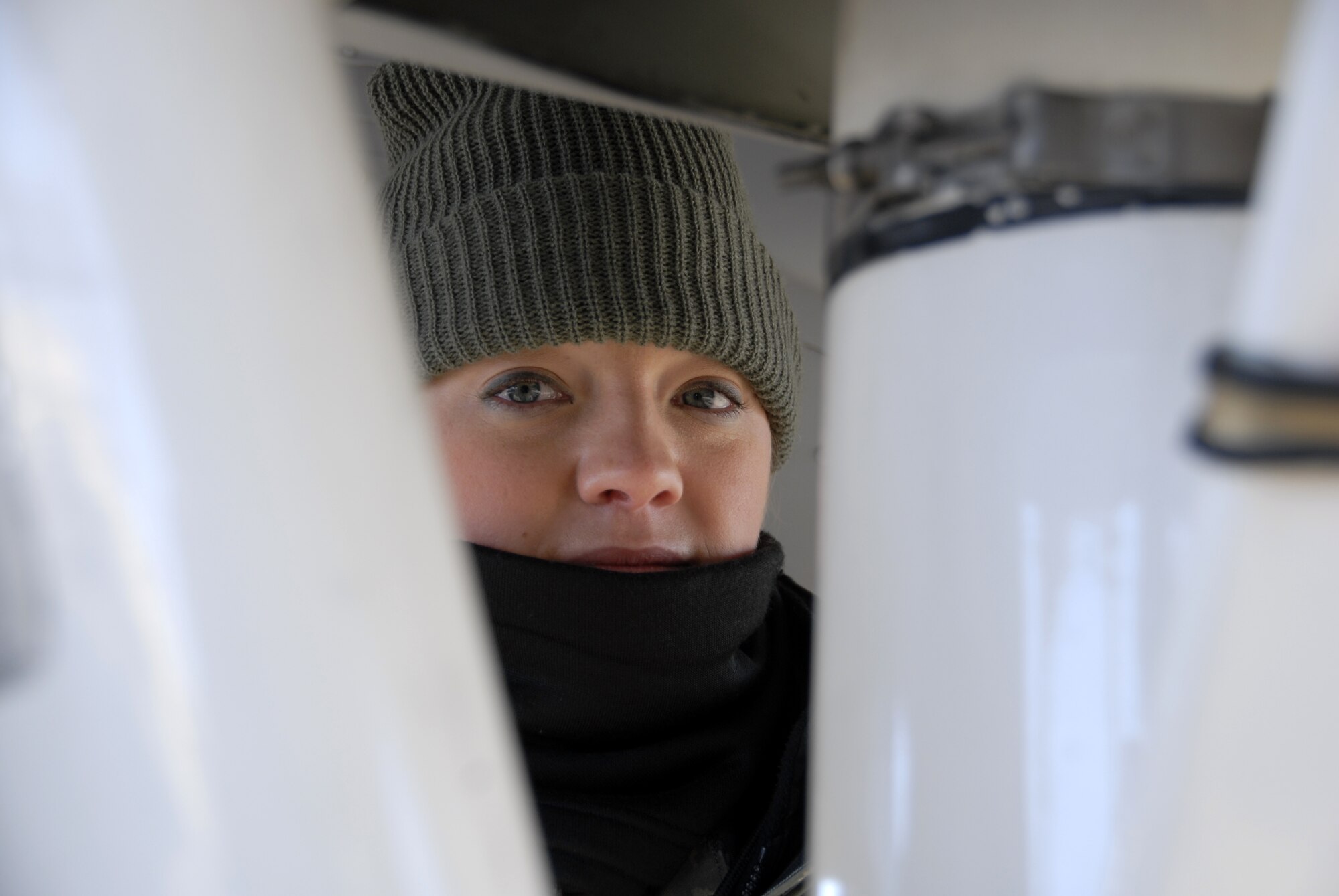 Senior Airman Andrea Sumner checks the nose-landing-gear assembly of a 442nd Fighter Wing A-10 Thunderbolt II at Whiteman Air Force Base, Mo., Dec. 6, 2008, prior to the plane's launch on a training flight.  The 442nd is an Air Force Reserve Command unit, which operates, maintains and supports A-10 combat operations worldwide.  (U.S. Air Force photo/Staff Sgt. Tom Talbert) 