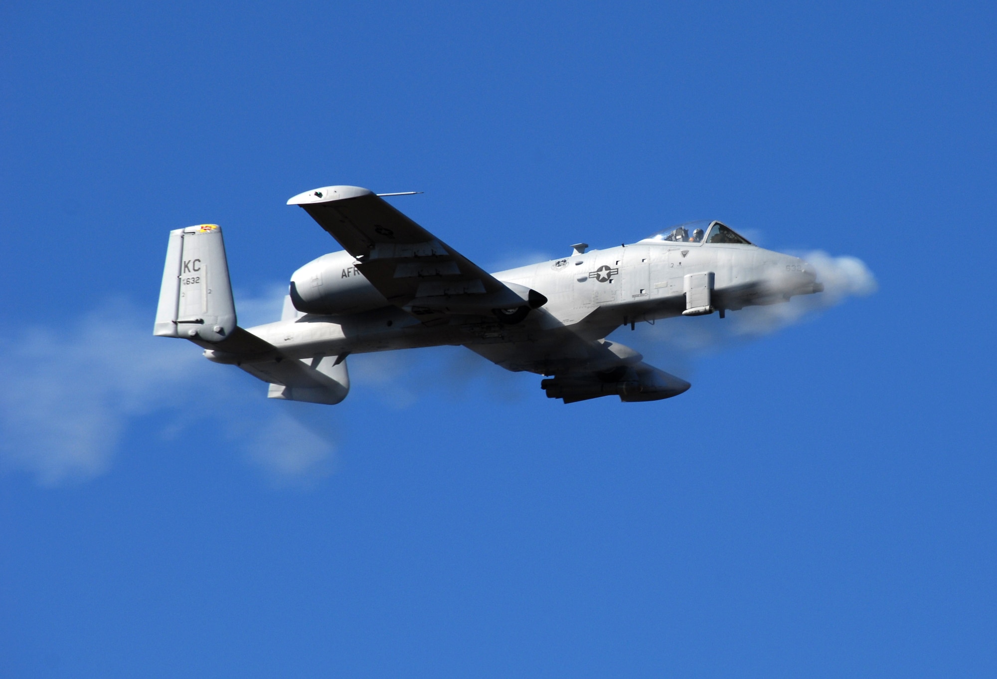 A pilot from the 442nd Operations Group's 303rd Fighter Squadron fires an A-10's 30-milimeter cannon over the Smoky Hill Range, Kan.  The group recently scored an "outstanding" on an inspection of its standardization and evaluation program.  The group is part of the 442nd Fighter Wing, an Air Force Reserve Command unit based at Whiteman Air Force Base, Mo.  (U.S. Air Force photo/Master Sgt. Bill Huntington)