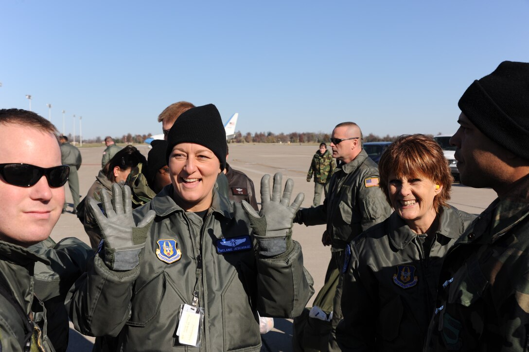 LEFT TO RIGHT:  Lt. Col. Melanie Jescavage and Lt. Col. Sally Bird enjoy a light moment together before embarking on the final adventure, or "fini" flight, in Colonel Bird's illustrious aeromedical evacuation career with the 932nd Airlift Wing.  It was 25 degrees in Illinois when they left and 80 degrees at their destination.  (U.S. Air Force photo/Maj. Stan Paregien)