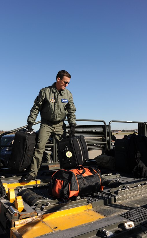 932nd Airlift Wing member Capt. Bruce Schlaeger gets aeromedical gear in place for lifting up to a KC-135 refueler at Scott Air Force Base, Ill.  He and other members of the squadron recently trained in both hot and cold conditions while flying for the Air Force Reserve Command.  (U.S. Air Force photo/Maj. Stan Paregien)