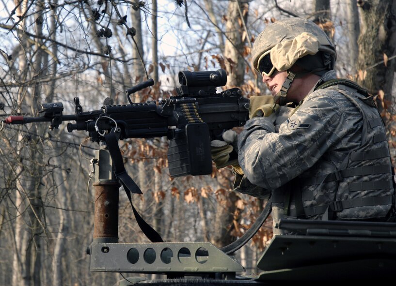 A student in the U.S. Air Force Expeditionary Center's Phoenix Warrior Training Course fires his machine gun during a scenario for convoy operations training in the course Dec. 5, 2008, on a Fort Dix, N.J., range.  The course is taught by the Center's 421st Combat Training Squadron and prepares security forces Airmen for upcoming deployments. (U.S. Air Force Photo/Staff Sgt. Paul R. Evans)