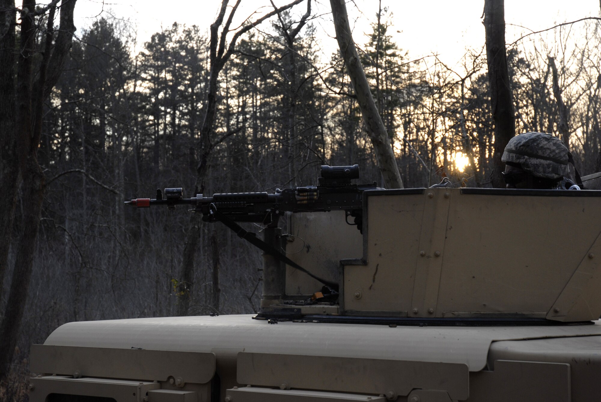 A student in the U.S. Air Force Expeditionary Center's Phoenix Warrior Training Course is ready in a gun turret of a high-mobility, multi-wheeled vehicle (HMMWV) during a scenario for convoy operations training in the course Dec. 5, 2008, on a Fort Dix, N.J., range.  The course is taught by the Center's 421st Combat Training Squadron and prepares security forces Airmen for upcoming deployments. (U.S. Air Force Photo/Staff Sgt. Paul R. Evans)