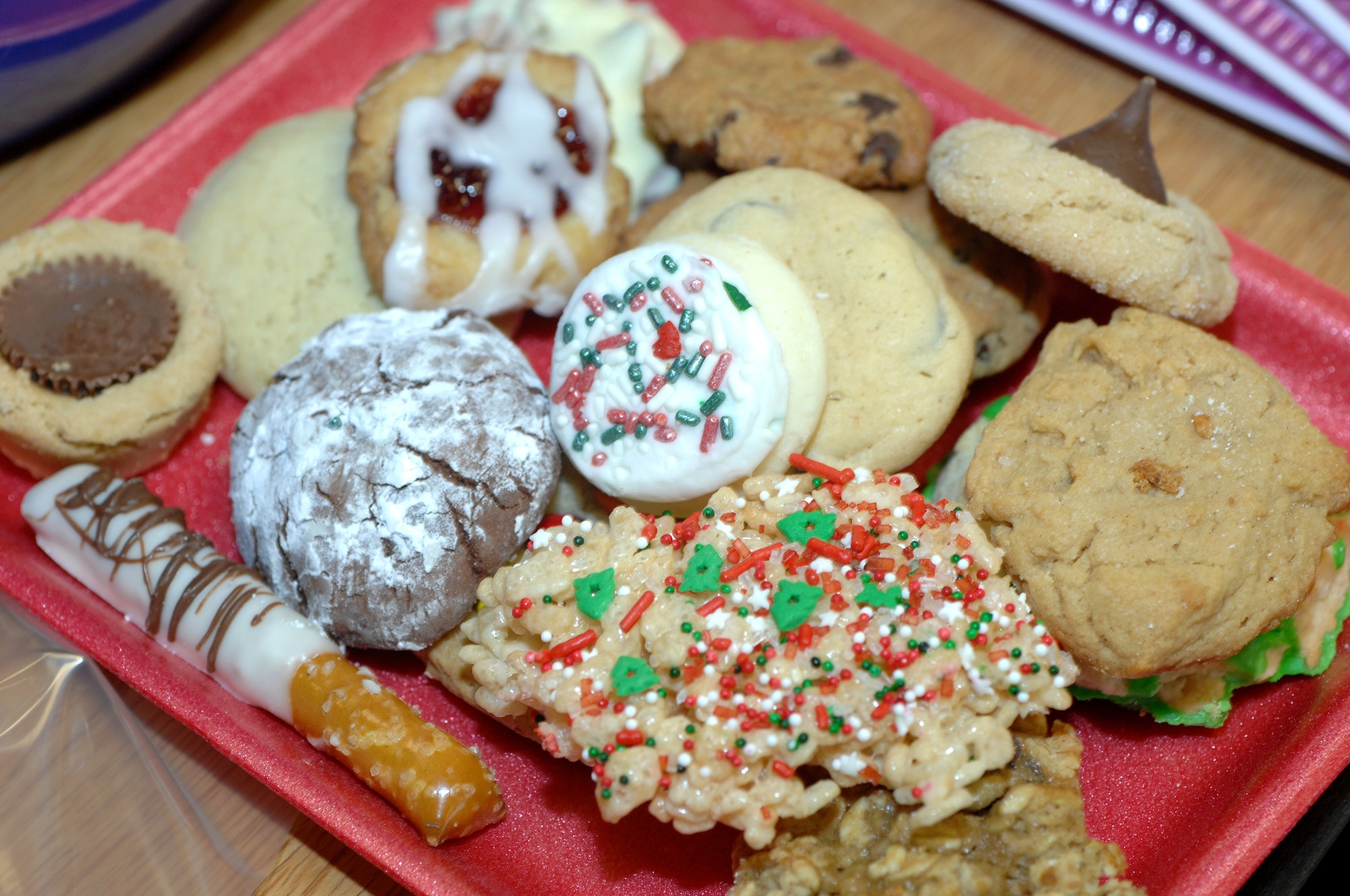 LANGLEY AIR FORCE BASE, Va. -- The Langley Officers' Spouses’ Club received approximately 2,000 dozen cookies Dec. 12 to distribute to 826 dormitory residences, other base personnel, and off-base agencies to include United Service Organizations. The cookie drive is an Air Force tradition to bring joy to young Airmen who spend the holidays away from home. (U.S. Air Force photo/Tech. Sgt. April Wickes)   