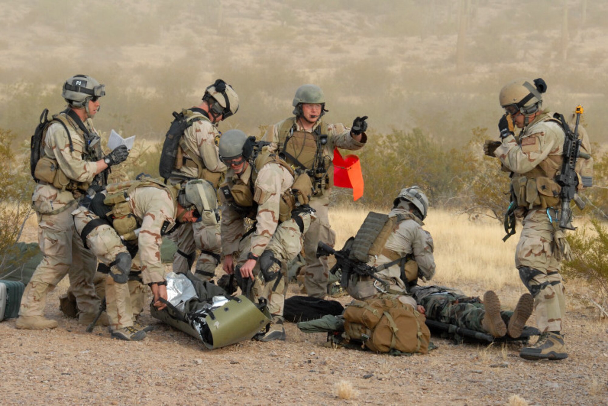 Exercise Angel Thunder participants prepare survivors for rescue by an inbound HH-60 Pavehawk crew.  The exercise took place at Davis- Monthan Air Force Base, Ariz., from Dec. 1-12.  Angel Thunder is the largest personnel recovery exercise in the world designed to train a joint, interagency and international audience in effectively executing the personnel recovery mission. (photo by Greg Morehead).