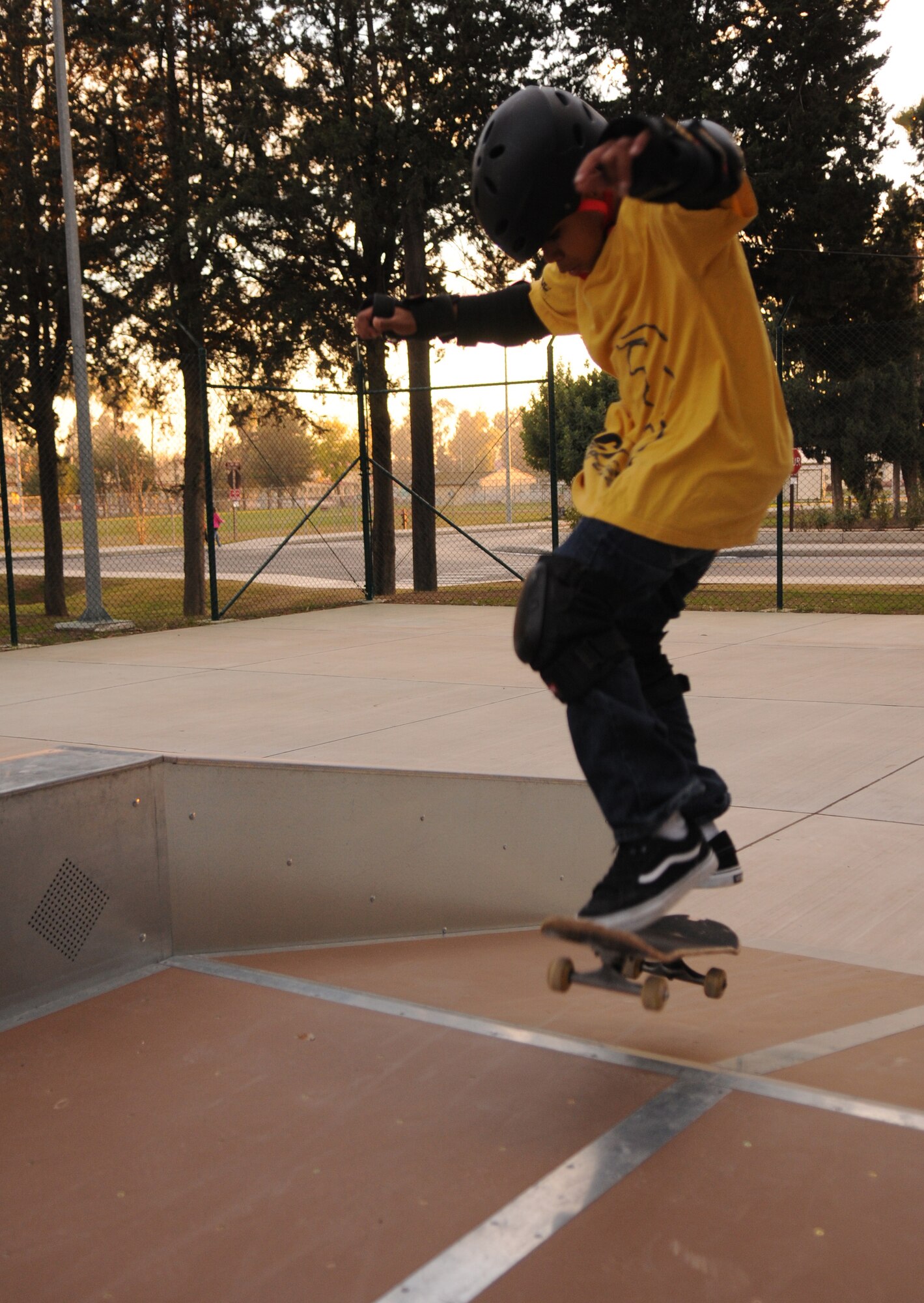 Marcus Little uses his skateboard to get air on a ramp at the grand opening of the youth centers’ new skate park, Dec. 12. (Air Force photo by Airman 1st class Amber Russell)