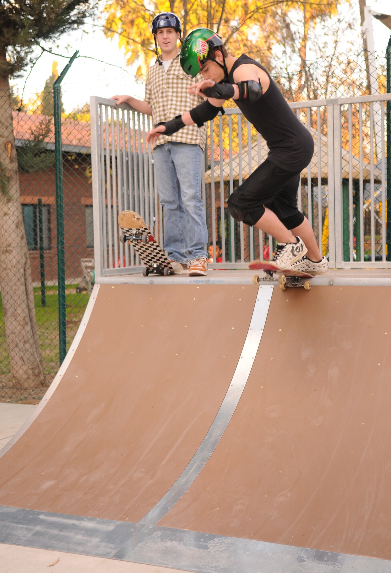 Matt Dalton drops in on a half-pipe at the grand opening of the youth centers’ new skate park, Dec. 12. (Air Force photo by Airman 1st class Amber Russell)