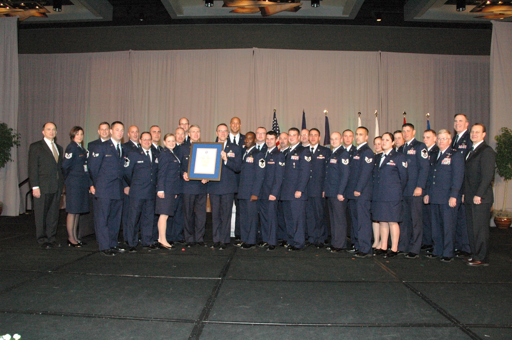 Members of the 1st Special Operations Maintenance Group, along with the 1st Special Operations Wing vice commander, Col. Mark Alsid, are presented with the Phoenix Award during a ceremony in Washington, D.C.The Phoeniz Award is the highest field-level maintenance award within the DOD. (Courtesy photo)