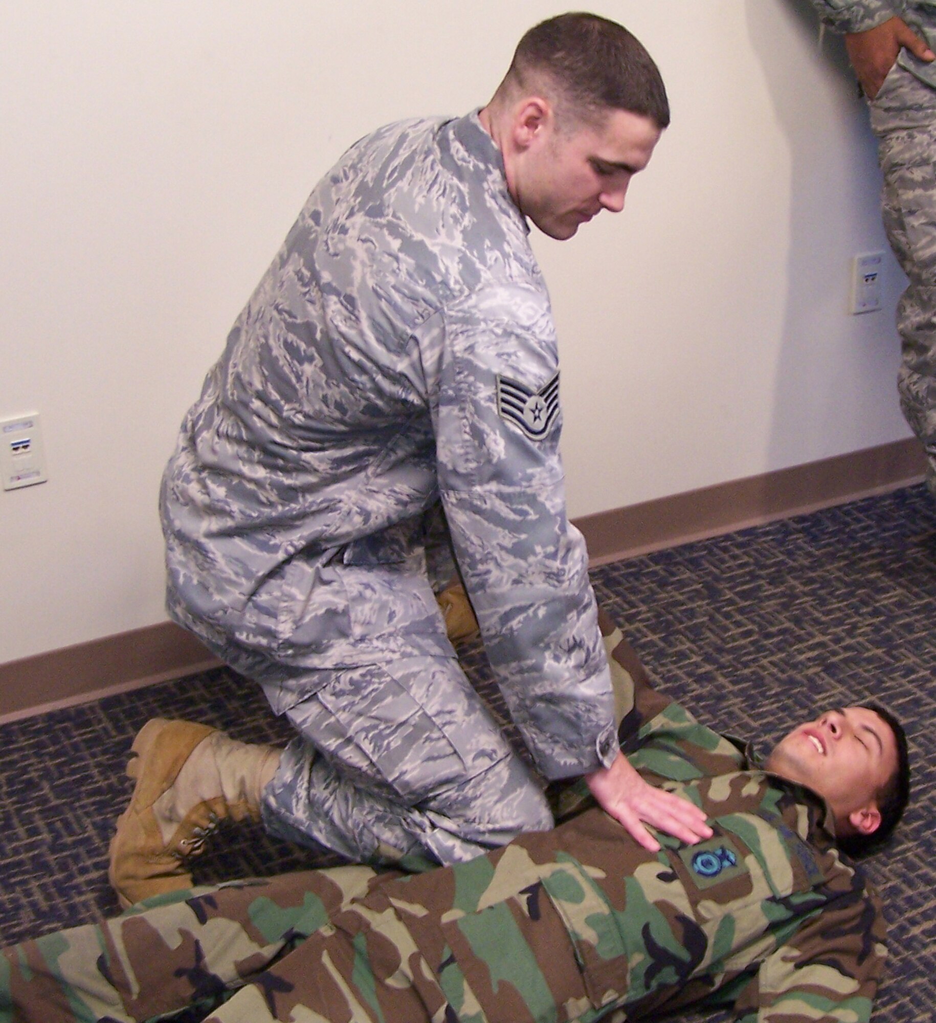 SEYMOUR JOHNSON AIR FORCE BASE, N.C. -- Staff Sgt. Geoffrey Buie (left) demonstrates self-defense tactics on Senior Airman Armondo Rooks during the December unit training assembly. Both are reservists with the 916th Security Forces Squadron and regularly conduct training in self-defense and other hand-to-hand combat areas as part of their continuing education.