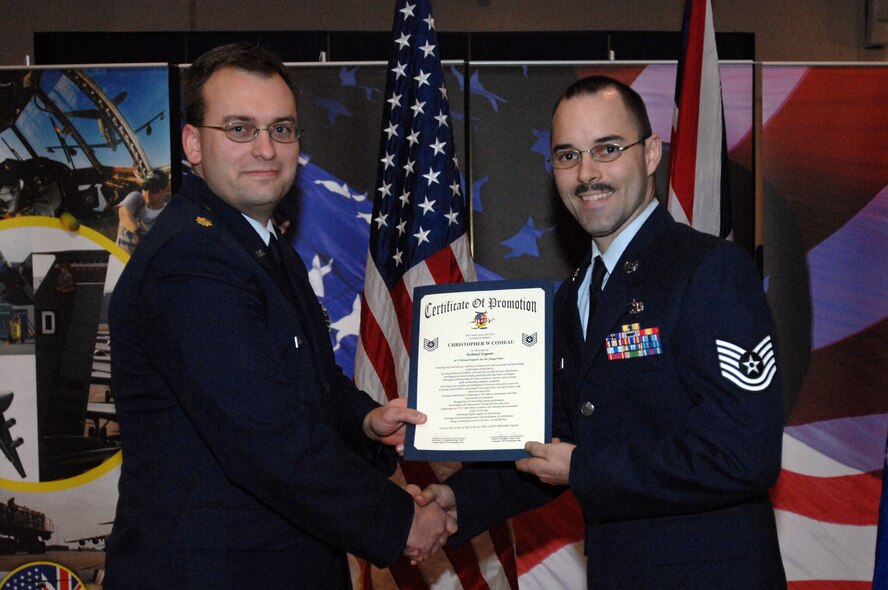 Staff Sgt. Christopher W. Comeau is promoted to the rank of technical sergeant by Maj. Lance D. Bartlett, from the 100th Maintenance Squadron, during the promotion ceremony held at the base theater Oct. 30, 2008, in RAF Mildenhall England. (U.S. Air Force photo by Staff Sgt. Jerry Fleshman)