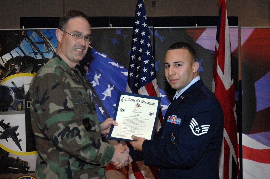 Senior Airman Darian Lira is promoted to the rank of staff sergeant by Lt. Col. David E. Stookey, 100th Communications Squadron commander, during a promotion ceremony at the base theater Oct. 30, 2008, in RAF Mildenhall, England. (U.S. Air Force photo by Staff Sgt. Jerry Fleshman)