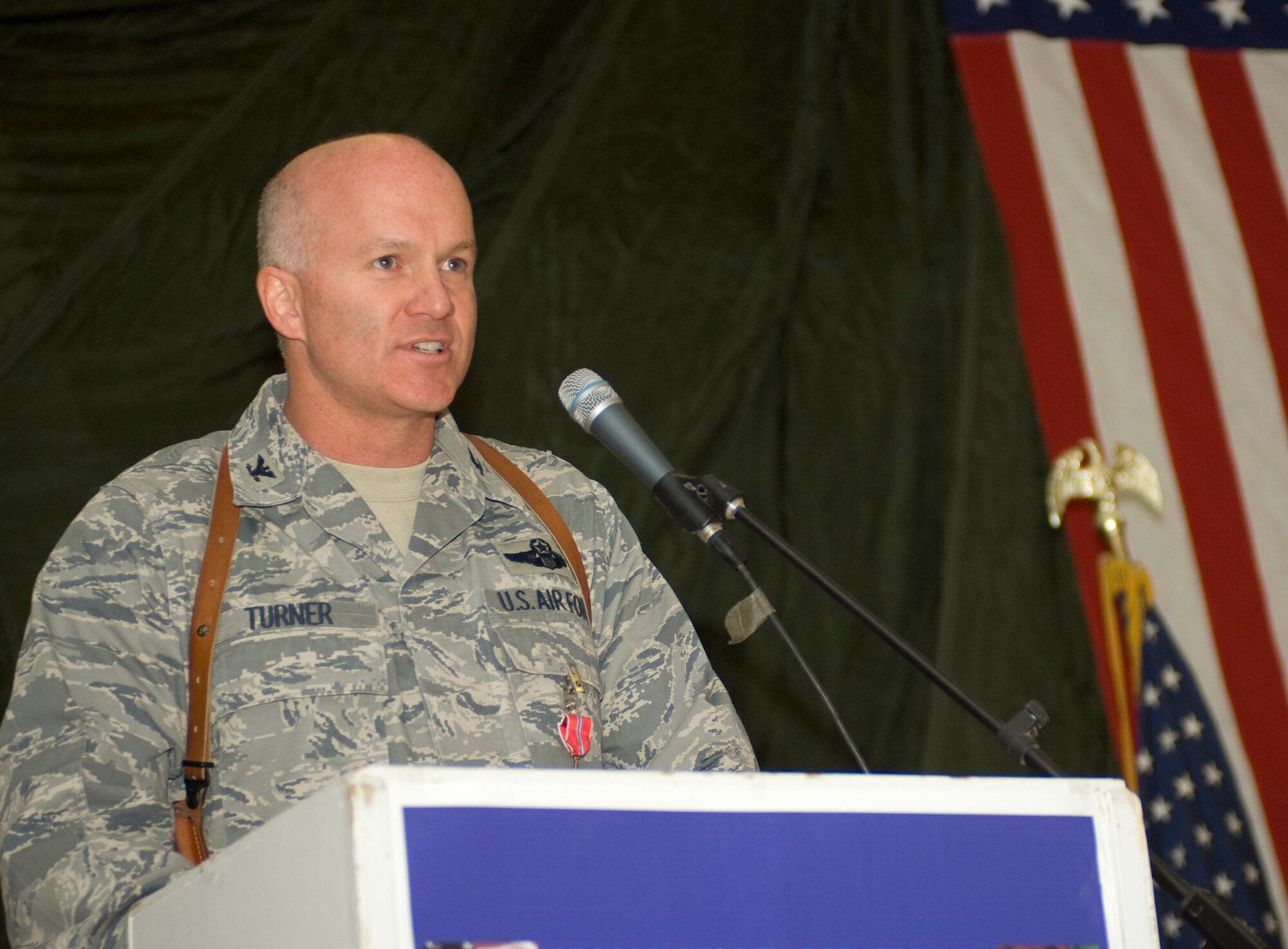 Col. Luther Turner, 451st Air Expeditionary Group commander, addresses the Airmen and Coalition partners in attendance at the 451st AEG change of command ceremony Dec. 13 at a base in Southern Afghanistan. Colonel Turner served as the 451st AEG commander from January 2008. His next assignment is as Headquarters Air Force Director of Operational Training. (U.S. Air Force photo by Staff Sgt. Rachel Martinez) (Released)