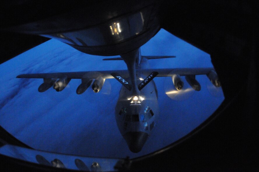 A KC-135 Stratotanker conducts air-to-air refueling with a MC-130 Hercules cargo plane from the 352nd Special Operations Group, both from RAF Mildenhall, in support of a rescue mission involving a critically injured crewman on a cargo vessel off the coast of Ireland. The KC-135 provided 42 thousand pounds of fuel for the mission. (U.S. Air Force Photo by Master Sgt. Charles Tubbs)