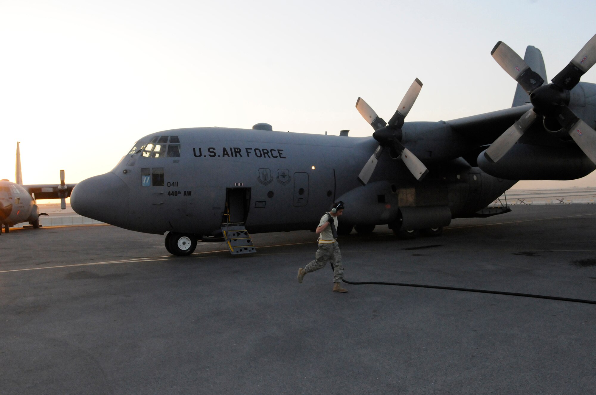 Tech. Sgt. Abner Berrios a crew chief assigned to the 379th Expeditionary Aircraft Maintenance Squadron removes the power cord from a C-130 Hercules after starting of the first engine, Dec. 13, 2008, at an undisclosed air base in southwest Asia.  The C-130 primarily performs the tactical portion of the airlift mission. The aircraft is capable of operating from rough, dirt strips and is the prime transport for air dropping troops and equipment into hostile areas in the Central Command area of responsibility.  Sergeant Berrios is a native of San Juan, Puerto Rico, and deployed from Pope Air Force Base, N.C., in support of Operations Iraqi and Enduring Freedom and Joint Task Force-Horn of Africa.  (U.S. Air Force photo by Tech. Sgt. Michael Boquette/Released)
