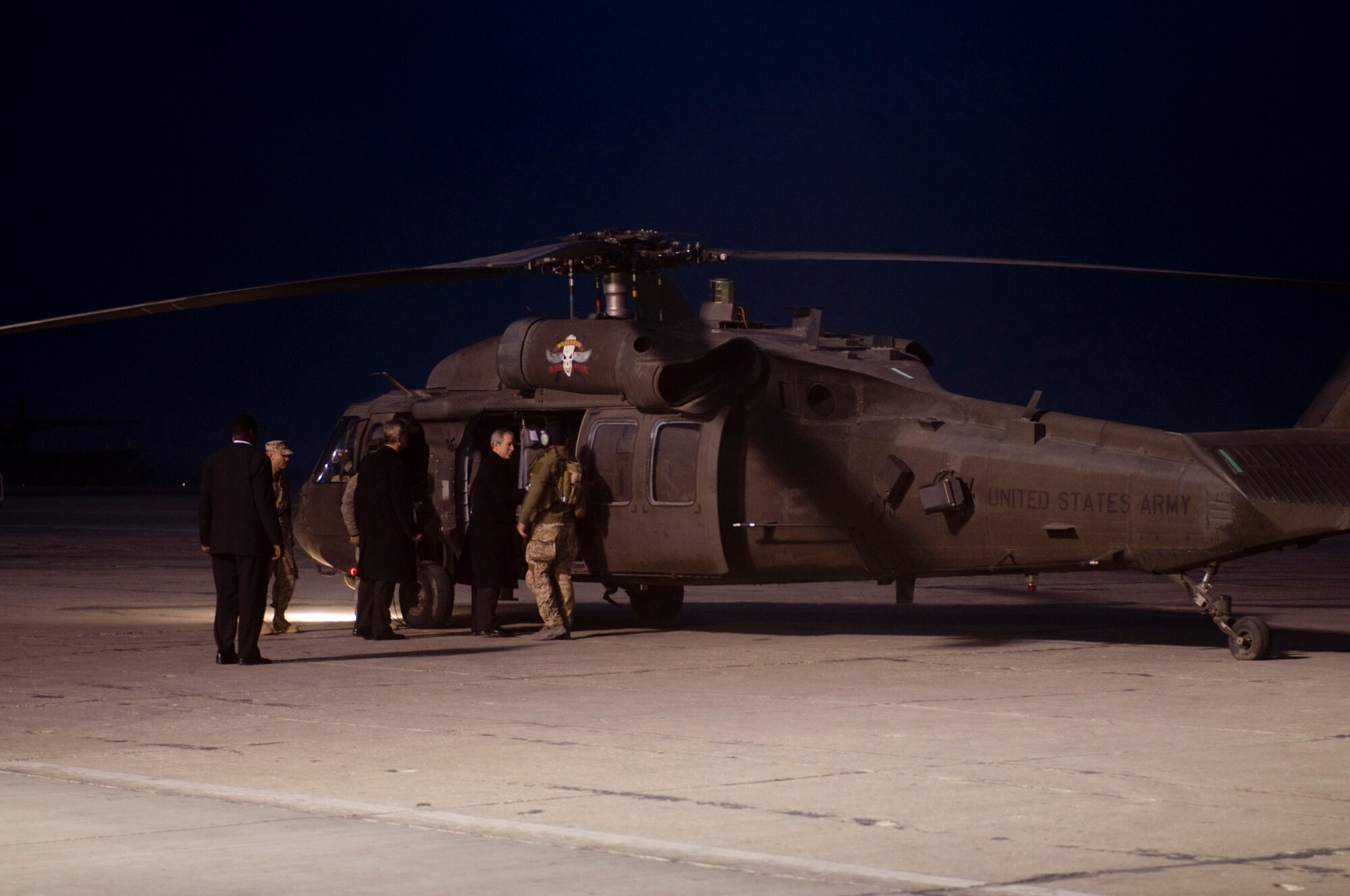 President George W. Bush boards an Army UH-60 Black Hawk helicopter at Bagram Air Field, Afghanistan, Dec. 15. He took time to shake hands with the crew before boarding. (U.S. Air Force photo by Staff Sgt. Samuel Morse)(Released)