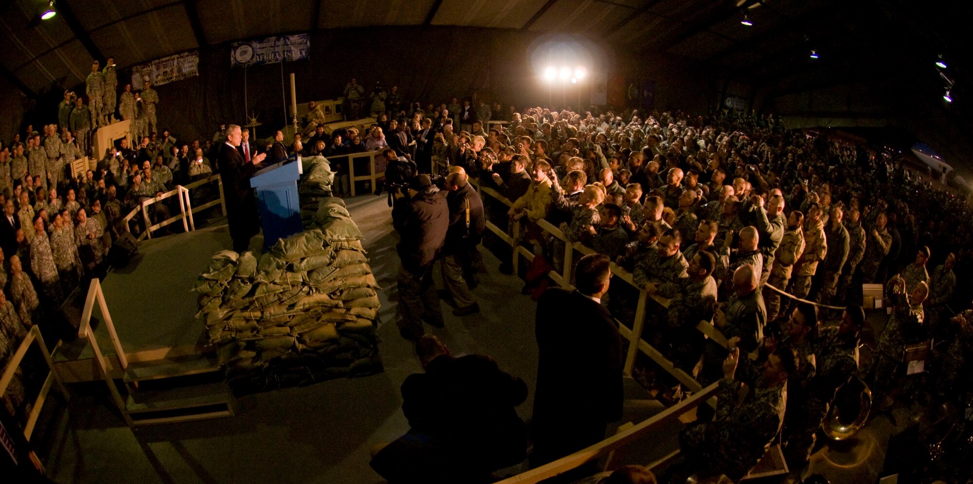 President George W. Bush addresses a crowd of military personnel and civilians gathered at Bagram Air Field, Afghanistan, Dec. 15. President Bush offered words of encouragement about the continued conflict in Afghanistan. (U.S. Air Force photo by Staff Sgt. Samuel Morse)(Released)
