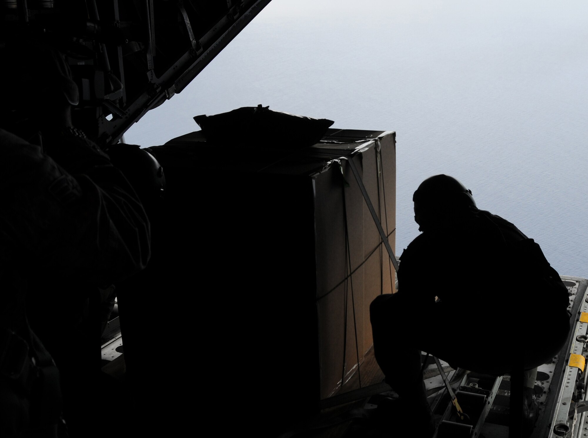 ANDERSEN AIR FORCE BASE, Guam - Staff Sgt. Ian Hunt, 36th Airlift Squadron loadmaster from Yokota Air Base, Japan, prepares a box of donated goods to be dropped on the Islands of Chuuk during Operation Christmas Drop. In all more than 180 boxes were built for the humanitarian mission, making 2008 one of the largest drops in Operation Christmas Drop's 57-year history. (U.S. Air Force photo by Staff Sgt Jamie Lessard)

