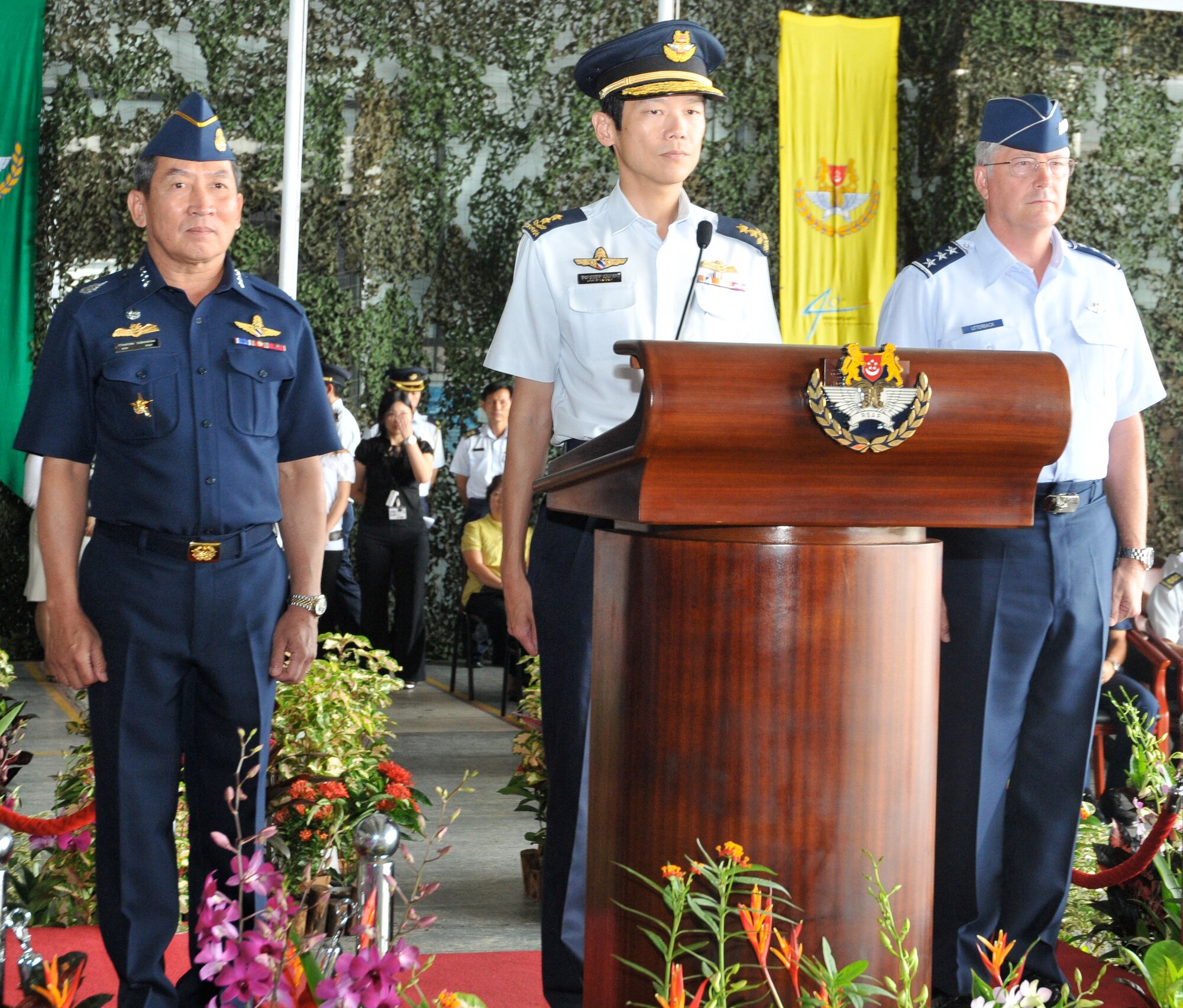 Air Chief Marshal Itthaporn Subhawong, Royal Thai Air Force Commander-in-Chief; Maj. Gen. Ng, Chee Khern, Republic of Singapore Air Force Chief of Air Force; and Lt. Gen. Chip Utterback, 13th Air Force Commander, participate in the Cope Tiger opening ceremony at Paya Lebar Air Base, Singapore, on Dec. 12.  The field training exercise portion of Cope Tiger, a multilateral exercise involving aviation and ground forces from the United States, Thailand and Singapore, will be held in the spring in Thailand. (Courtesy photo)