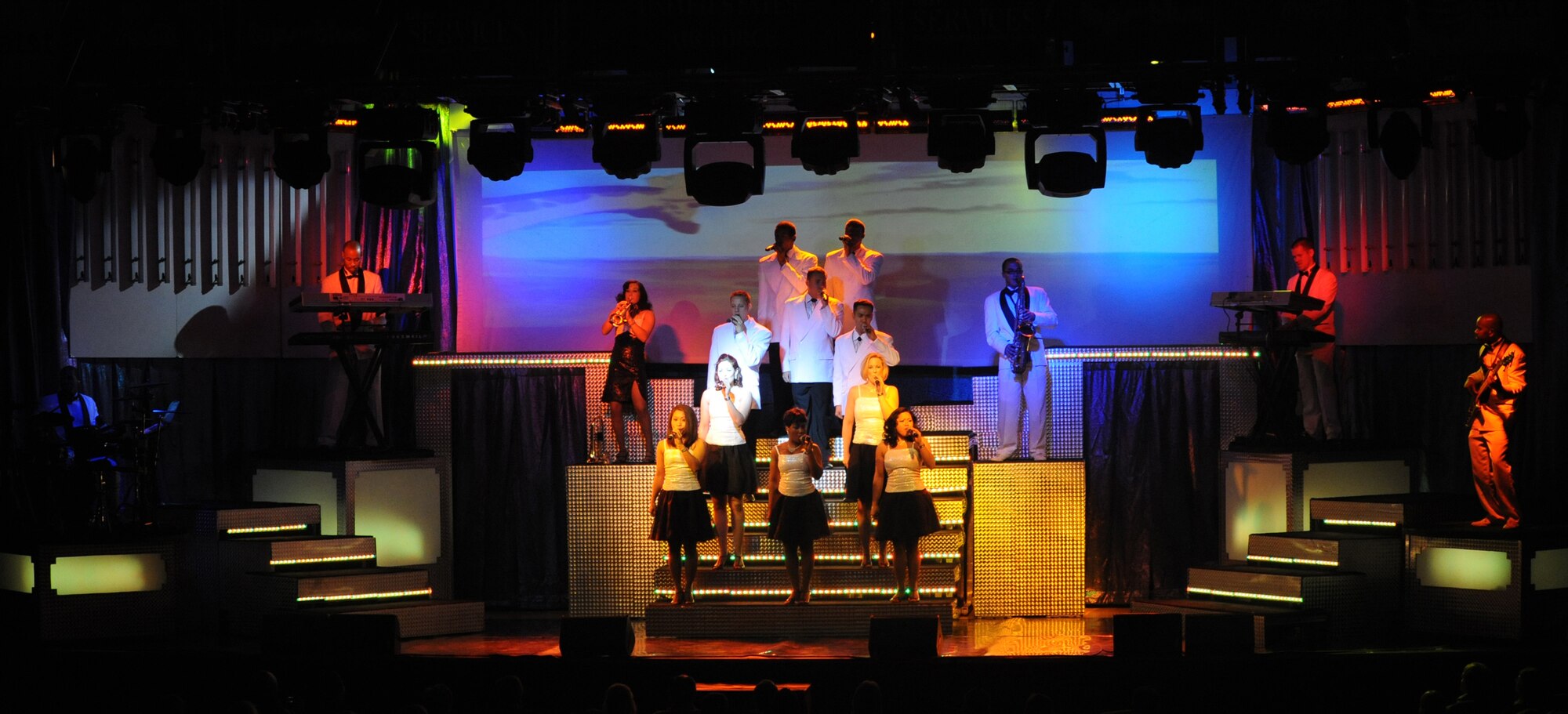ELMENDORF AIR FORCE BASE, Alaska -- Members of Tops in Blue sing for the attendants during the "Deja Blue" performance at the base theater Dec. 14. The Air Force's premier entertainment showcase is responsible for more than 80,000 pounds of staging, lighting, audio and special effects equipment used for each show. (U.S. Air Force photo/Senior Airman Matthew Owens)