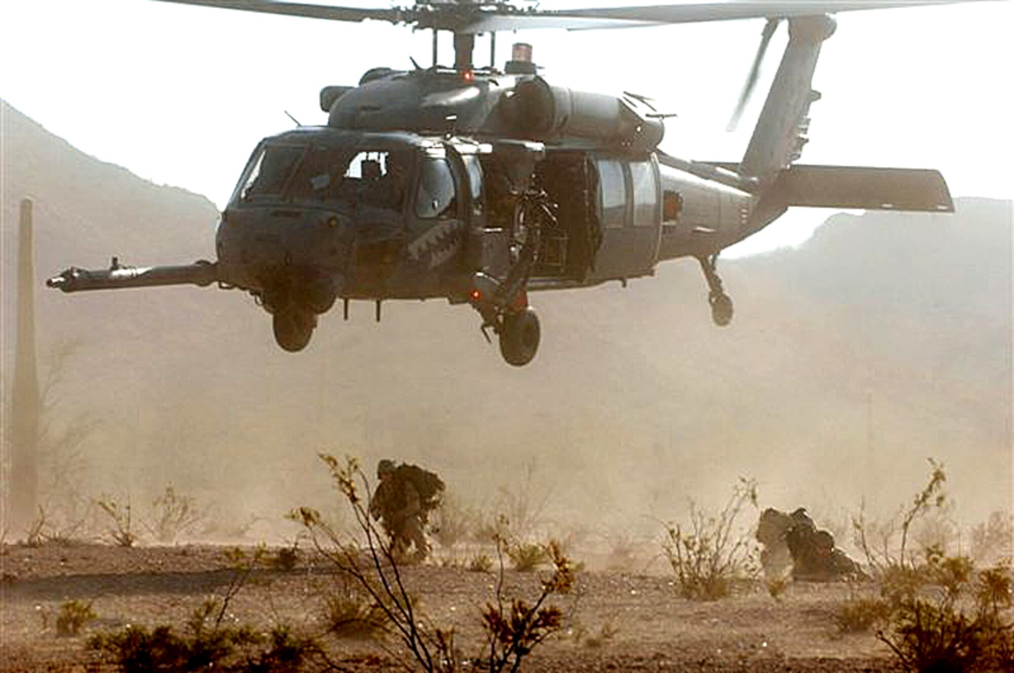 HH-60 Pave Hawk helicopter during Exercise Angel Thunder July 16 at Gila Bend, Ariz.  The Airmen are from Davis-Monthan Air Force Base, Ariz. (U.S. Air Force photo/Staff Sgt. Lanie McNeal)