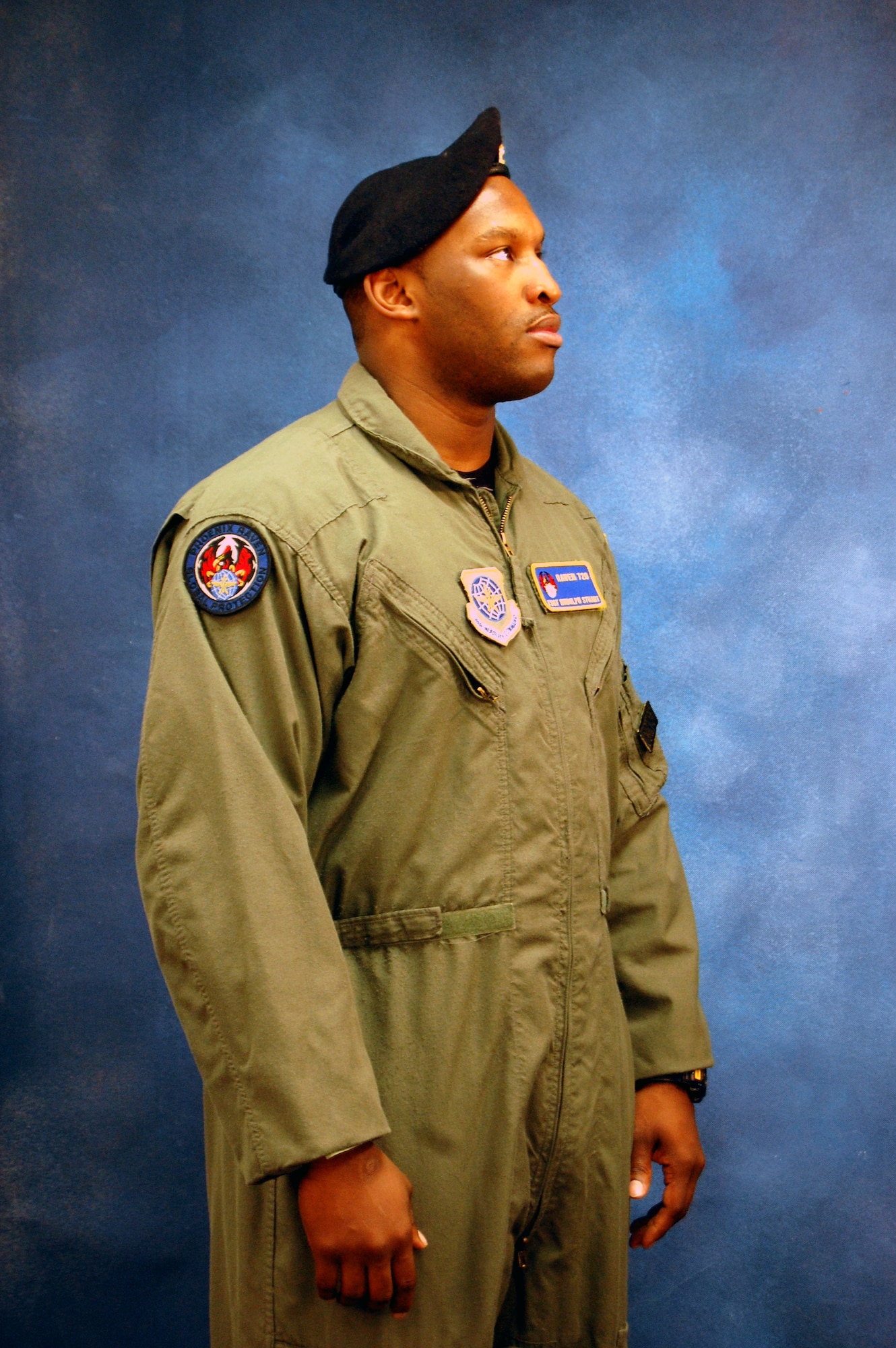 Tech. Sgt. Rudolph Stuart, security forces contingency skills and Raven instructor with the U.S. Air Force Expeditionary Center's 421st Combat Training Squadron, models for a photo Dec. 11, 2008, in the Expeditionary Center studio on Fort Dix, N.J.  The effort was part of preparatory work by an artist from the Air Force Art Program to complete a painting highlighting Expeditionary Center Airmen. (U.S. Air Force Photo/Tech. Sgt. Scott T. Sturkol)