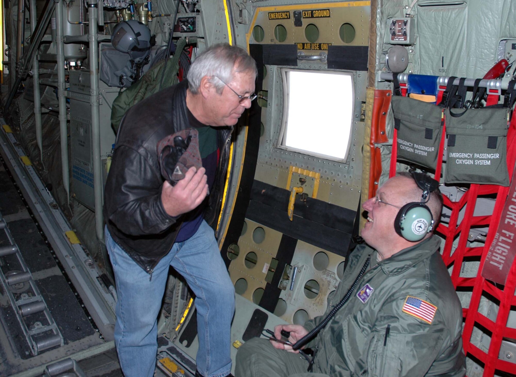 Rev. Bruce Nelson, Bethany Lutheran Church, Minneapolis, talks with Master Sgt. Mark Blank, 96th Airlift Squadron loadmaster, during the 934th Airlift Wing Clergy Day Dec. 10. (Air Force Photo/Capt. S.J. Brown) 

