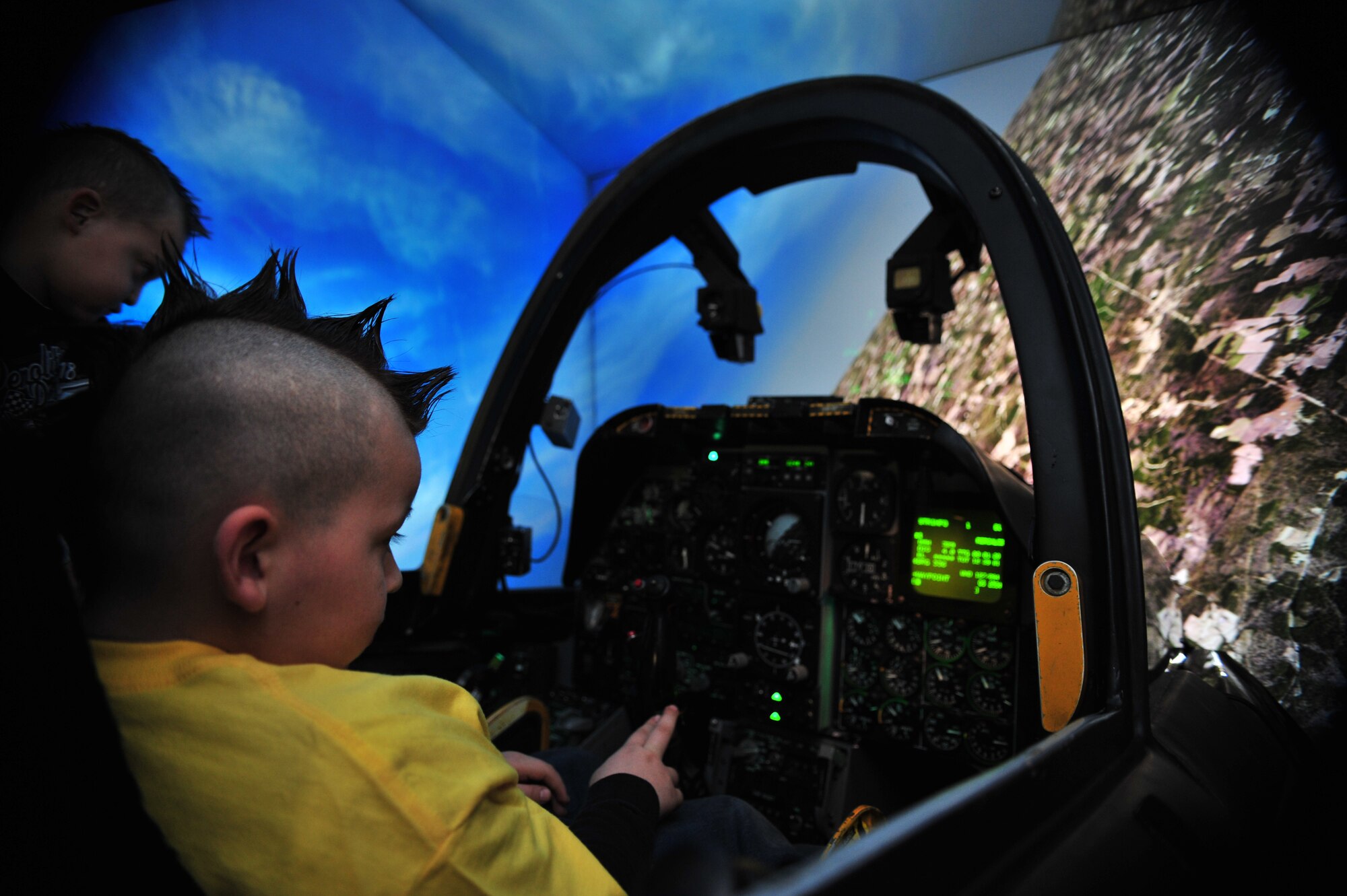 Pilot for a Day, Marcos Pacheco, flies an A-10 simulator during his visit to D-M Dec. 12. The Pilot For A Day program is designed to help children with disabilities or serious illnesses enjoy a day focused on them and their interest in aviation. (U.S. Air Force photo/Senior Airman Noah R. Johnson)

 
