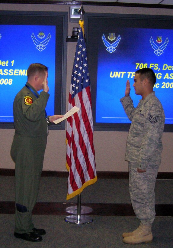 Tech. Sgt. Matt Pichelmayer (right) was reenlisted into the U.S. Air Force Reserve by Lt. Col. Patrick Ryan, 706th Fighter Squadron Detachment 1 commander, during the detachment's Unit Training Assembly on Dec. 9. at Hurlburt Field, Fla. Sergeant Pichelmayer joined the detachment as a network technician, and will be integrated into the 505th Communications Squadron, a regular Air Force unit at Hurlburt Field. Through Total Force Integration, reservists from the 706th FS Det. 1 are integrated into RegAF units, working side by side their RegAF counterparts on a regular basis to get the mission done. Sergeant Pichelmayer is the detachment's first enlisted member to be integrated into the 505th Command and Control Wing. The 706th FS Det. 1 is one of three geographically-separated units under the 926th Group at Nellis Air Force Base, Nev. The 926th GP supports the United States Air Force Warfare Center’s mission of ensuring deployed forces are well-trained and well-equipped to conduct integrated combat operations by certifying equipment, developing tactics, and providing premiere education and exercise venues. (Photo courtesy of 706th FS Det. 1)