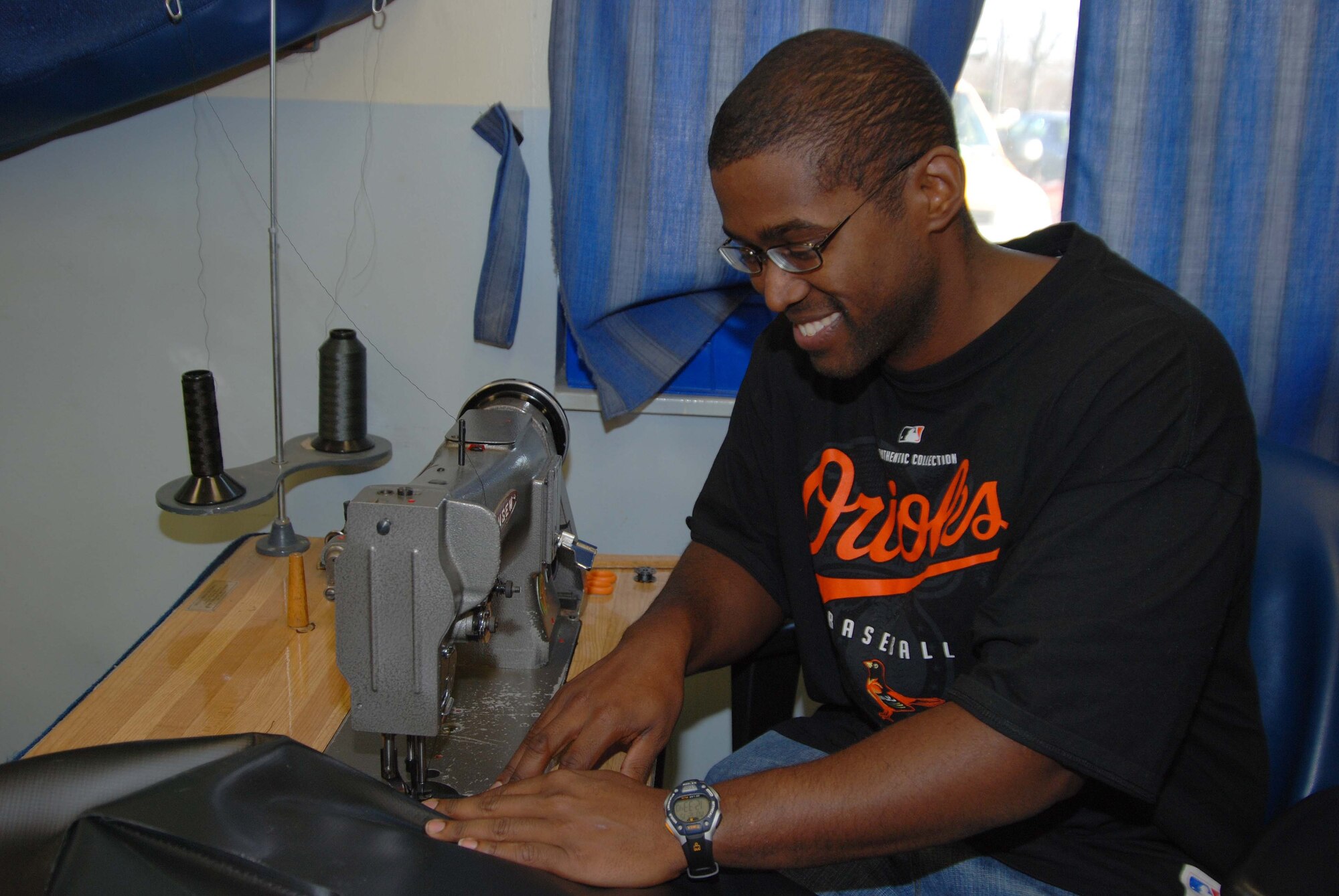 Staff Sgt. Norman T. Brown II, 459th Operations Support Flight, aircrew flight equipment technician, sews a cover for fuel cell test equipment. AFE personnel ensure that both aircrew and passengers have what they need to survive in the event of a crash. (U.S. Air Force photo/ Senior Airman Ashley Crawford)