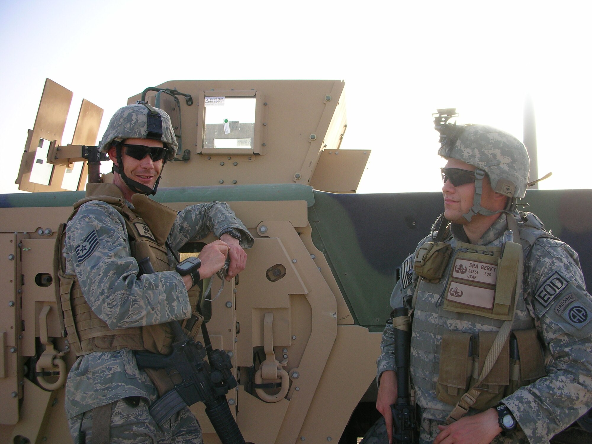 Tech. Sgt. John Carrol (left) and Senior Airman Bryan Berky, 755th Expeditionary Mission Support Group, Explosive Ordinance Disposal Company Bravo, take a break during an improvised explosive device detection operation in the Nimruz Province, Afghanistan, July 4, 2007.  Ellsworth has more than 400 total military members deployed to various locations worldwide in support of the Global War on Terror. (U.S. Air Force photo/courtesy photo)