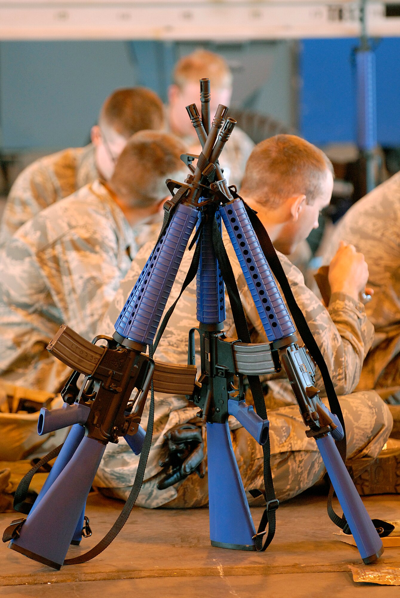 Four airmen found a way not to lay down their weapon during their lunch time at the Combat Skills Training Dec.12. The 362nd Training Sqaudeon implemented combat training into their Air Force specialties to prepare the future flight crew chiefs for deployments. (U.S. Air Force photo/Harry Tonemah)