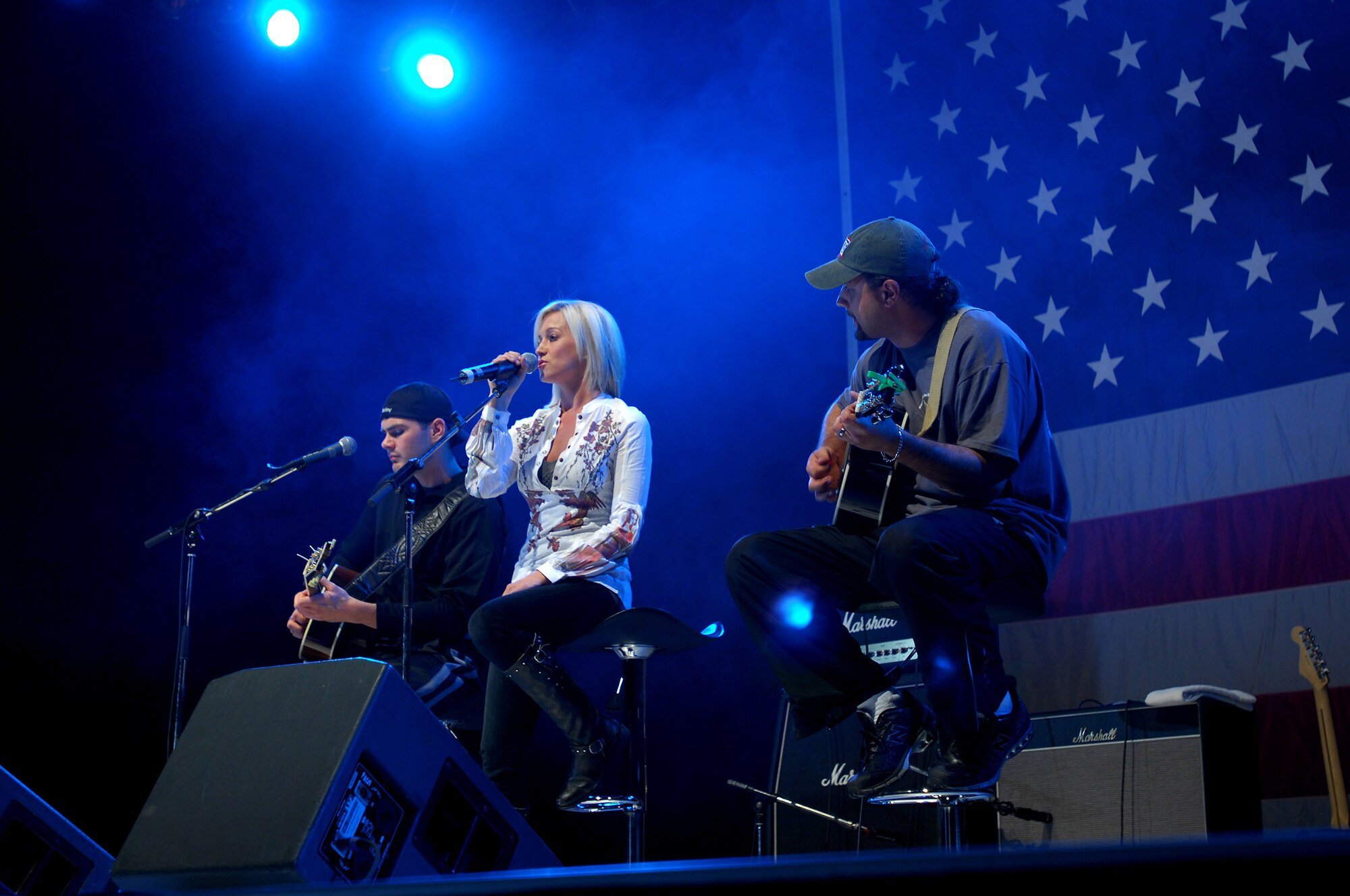 Kelly Pickler performs during the United Service Organizations (USO) Holiday Tour stop in Hanger 1 at Ramstein Air Base, Germany, Dec. 16, 2008. Other USO entertainers included Lewis Black and Kid Rock. (U.S. Air Force photo by Airman 1st Class Kenny Holston)
