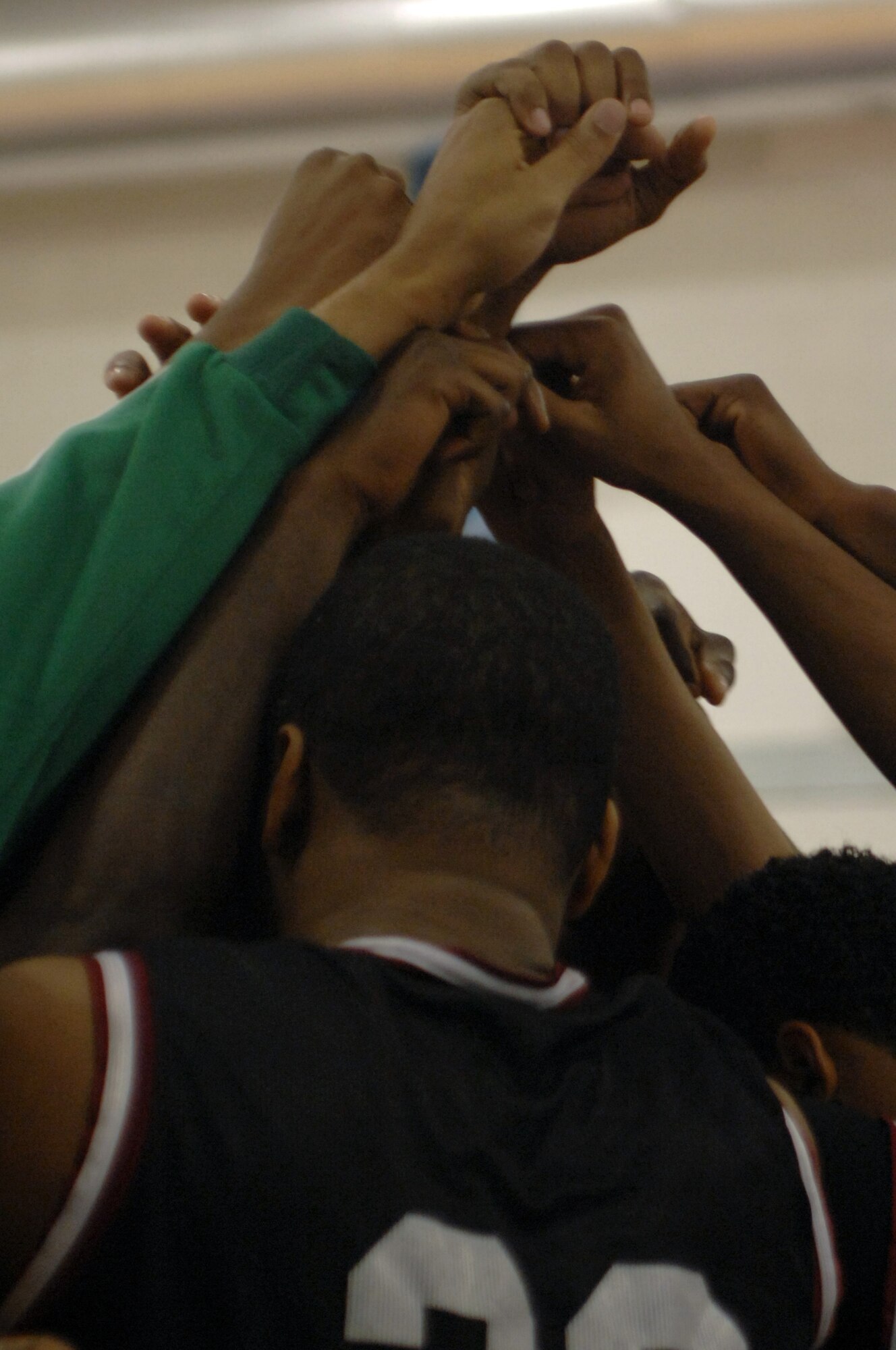 The Mildenhall Marauders come together at the end of a time out during the David Allen Basketball Tournament held at RAF Lakenheath Dec. 12 through 14, 2008. The Mildenhall Marauders took second losing to Ramstein 74 - 81.
(U.S. Air Force photo by Senior Airman Teresa M. Hawkins)