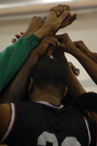 The Mildenhall Marauders come together at the end of a time out during the David Allen Basketball Tournament held at RAF Lakenheath Dec. 12 through 14, 2008. The Mildenhall Marauders took second losing to Ramstein 74 - 81.
(U.S. Air Force photo by Senior Airman Teresa M. Hawkins)