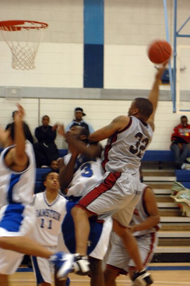 Byron Washington, 100th Civil Engineer Squadron, goes for a lay-up during the David Allen Basketball Tournament at RAF Lakenheath Dec. 12 through 14, 2008. The Mildenhall Marauders took second losing to Ramstein 74 - 81.
(U.S. Air Force photo by Senior Airman Teresa M. Hawkins)