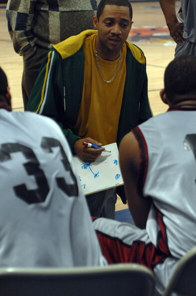 Corey Fletcher, 100th Maintenance Operation Squadron, discusses plays with the Mildenhall Marauders during the David Allen Basketball Tournament at RAF Lakenheath Dec. 12 through 14, 2008. The Mildenhall Marauders took second losing to Ramstein 74 to 81. (U.S. Air Force photo by Senior Airman Teresa M. Hawkins)