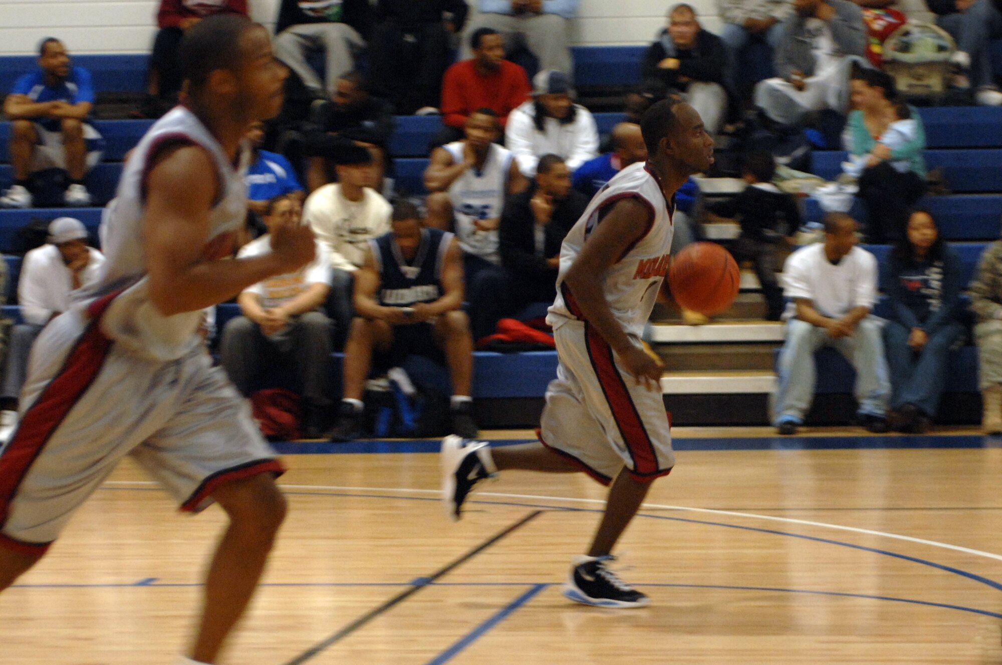 Shane Cochran drives the ball down the court toward the Mildenhall Marauder’s basket during the David Allen Basketball Tournament held at RAF Lakenheath Dec. 12 through 14, 2008. The Mildenhall Marauders took second losing to Ramstein 74 - 81. (U.S. Air Force photo by Senior Airman Teresa M. Hawkins)