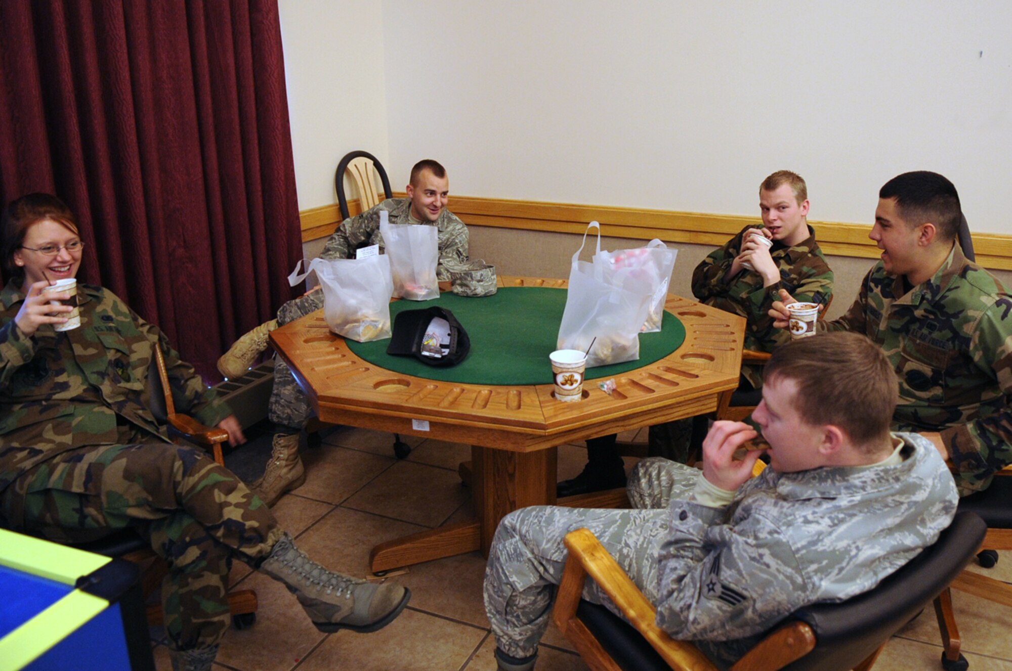 BUCKLEY AIR FORCE BASE, Colo. -- Buckley Air Force Base dorm residents enjoy cookies and hot cocoa from the Cookie Caper Dec. 11. The volunteer program, in its 14th year, donated more than 9,200 cookies to dorm residents and work centers here this year. (U.S. Air Force photo by Senior Airman John Easterling)